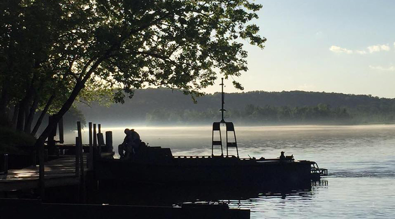 Bridge Crewmember of the 310th Engineer Company stands watch over his boat