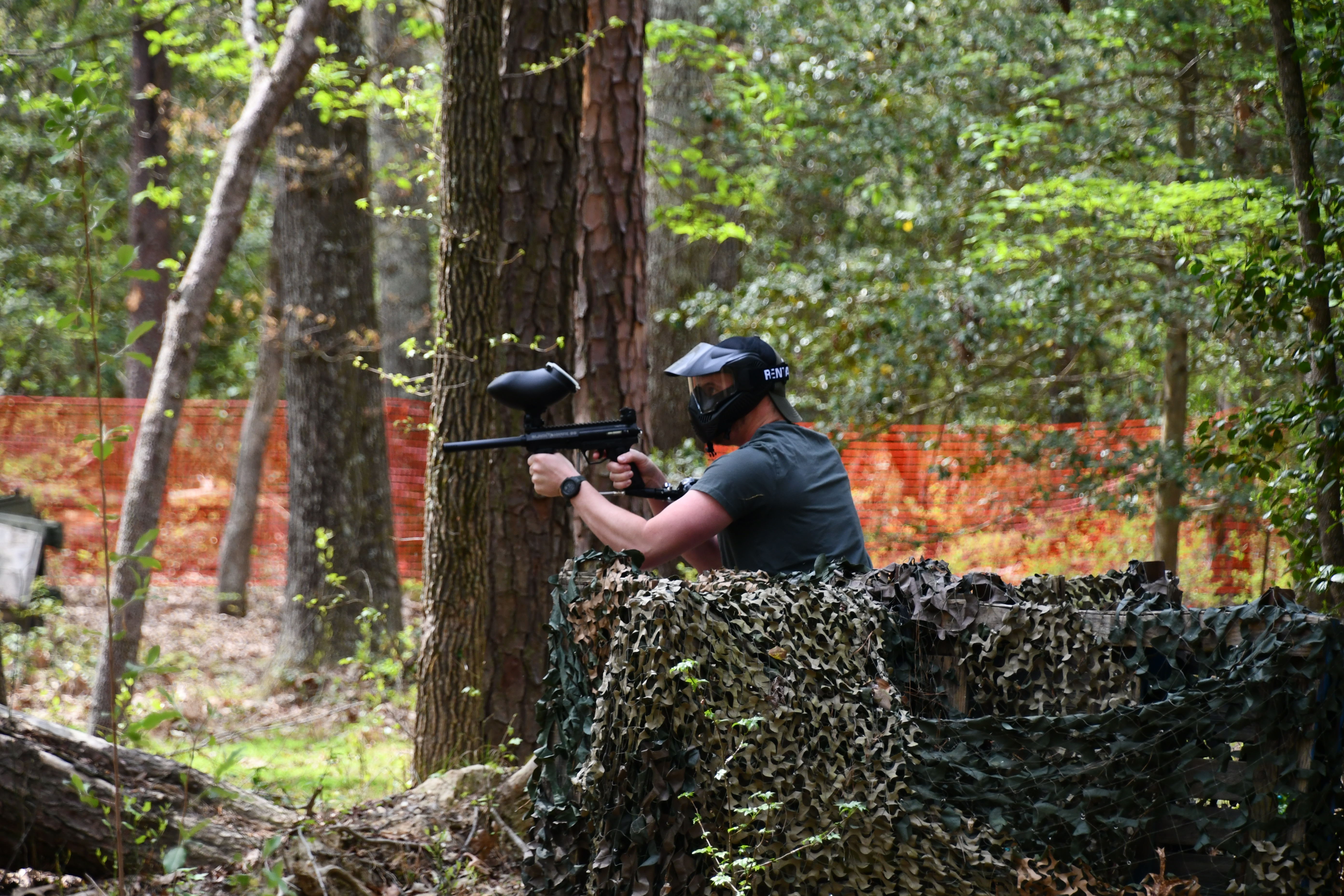 Matt Dean of Fort Walker’s Department of Public Works takes careful aim before he takes his shot at the grand re-opening of paintball course on 17 April.