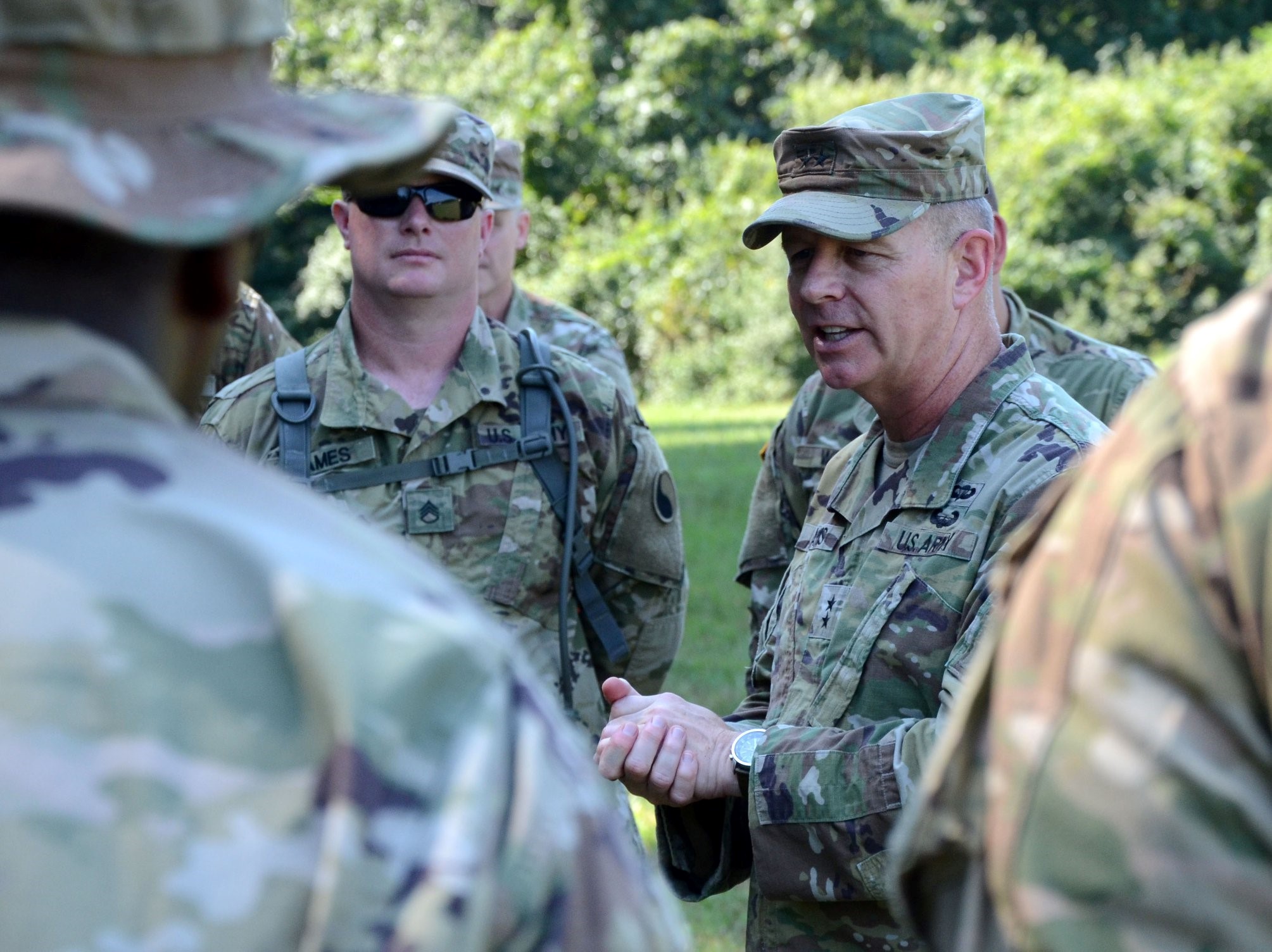 Virginia National Guard Soldiers assigned to the Sandston-based 2nd Battalion, 224th Aviation Regiment visit with Maj. Gen. Timothy P. Williams, the Adjutant General of Virginia, during their annual training July 21, 2019, at Fort Walker, Virginia.