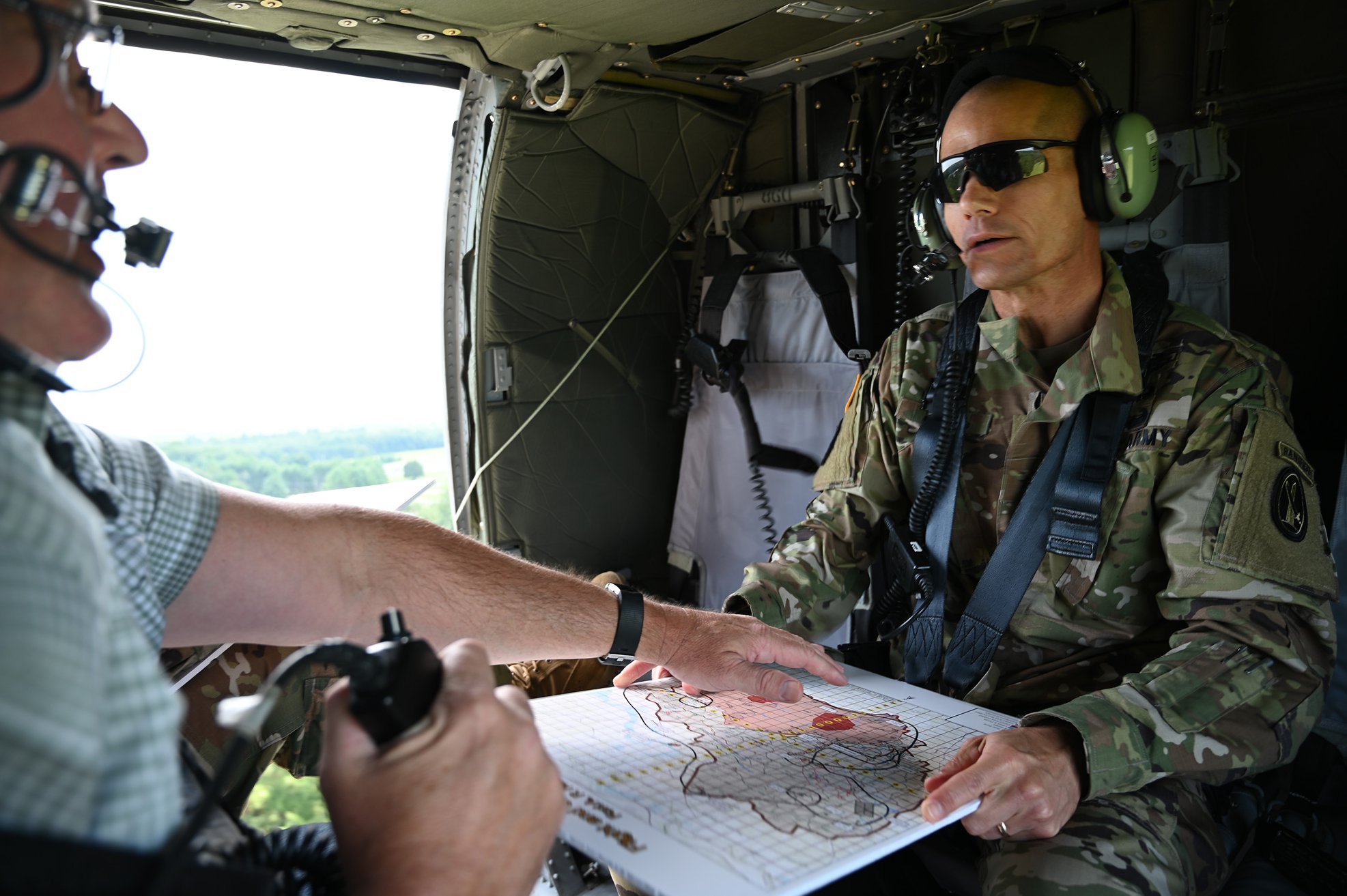 Fort Walker Range Officer Scott T. Kittle (left) briefed Brig. Gen. Omar J. Jones IV during his aerial tour of the installation on July 10, 2019.