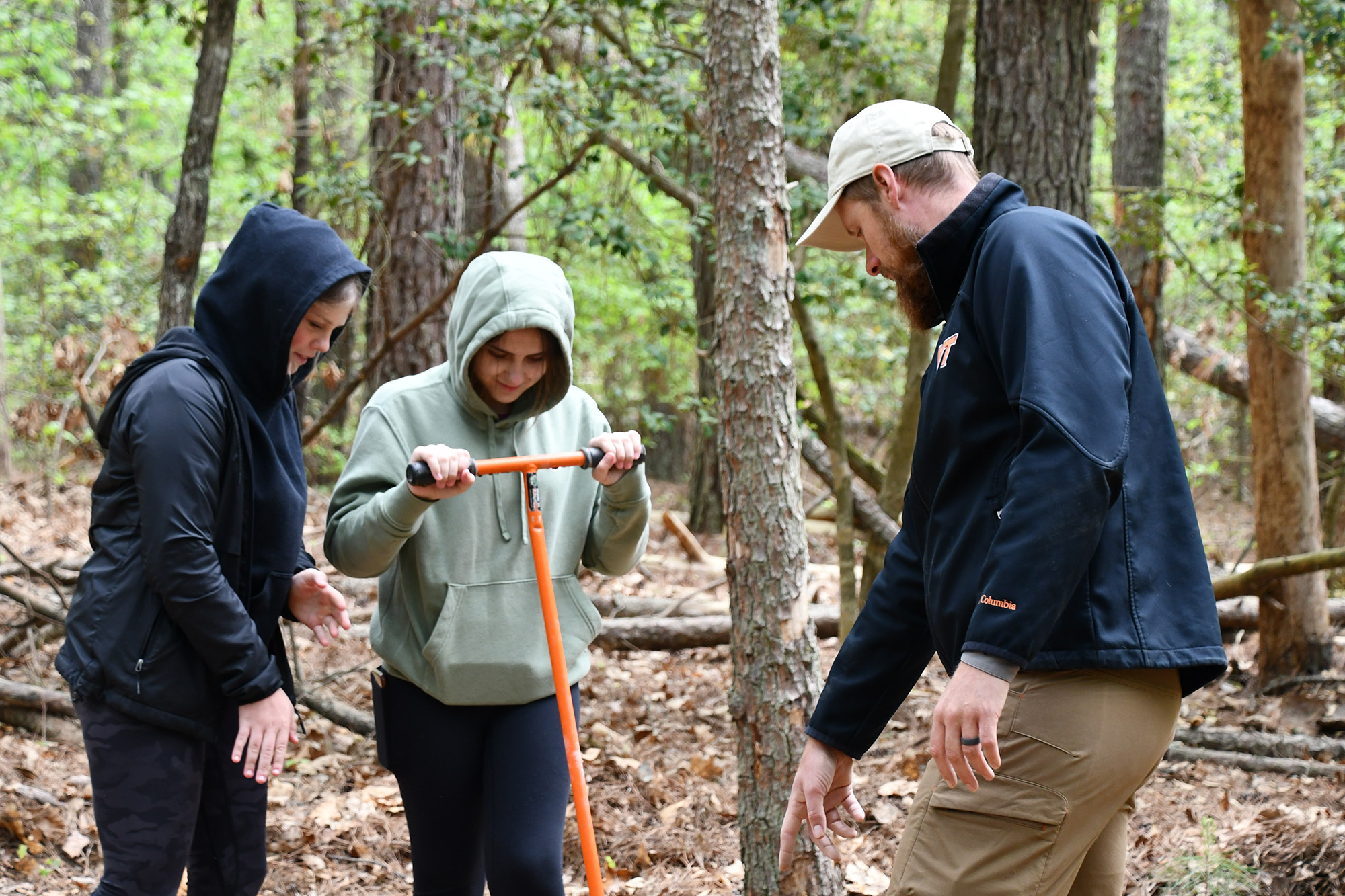 Environmental Specialist John Parker assists Caroline County School students in boring for soil samples at the Fort Walker Earth Day Festival on April 25 and 26, 2024.