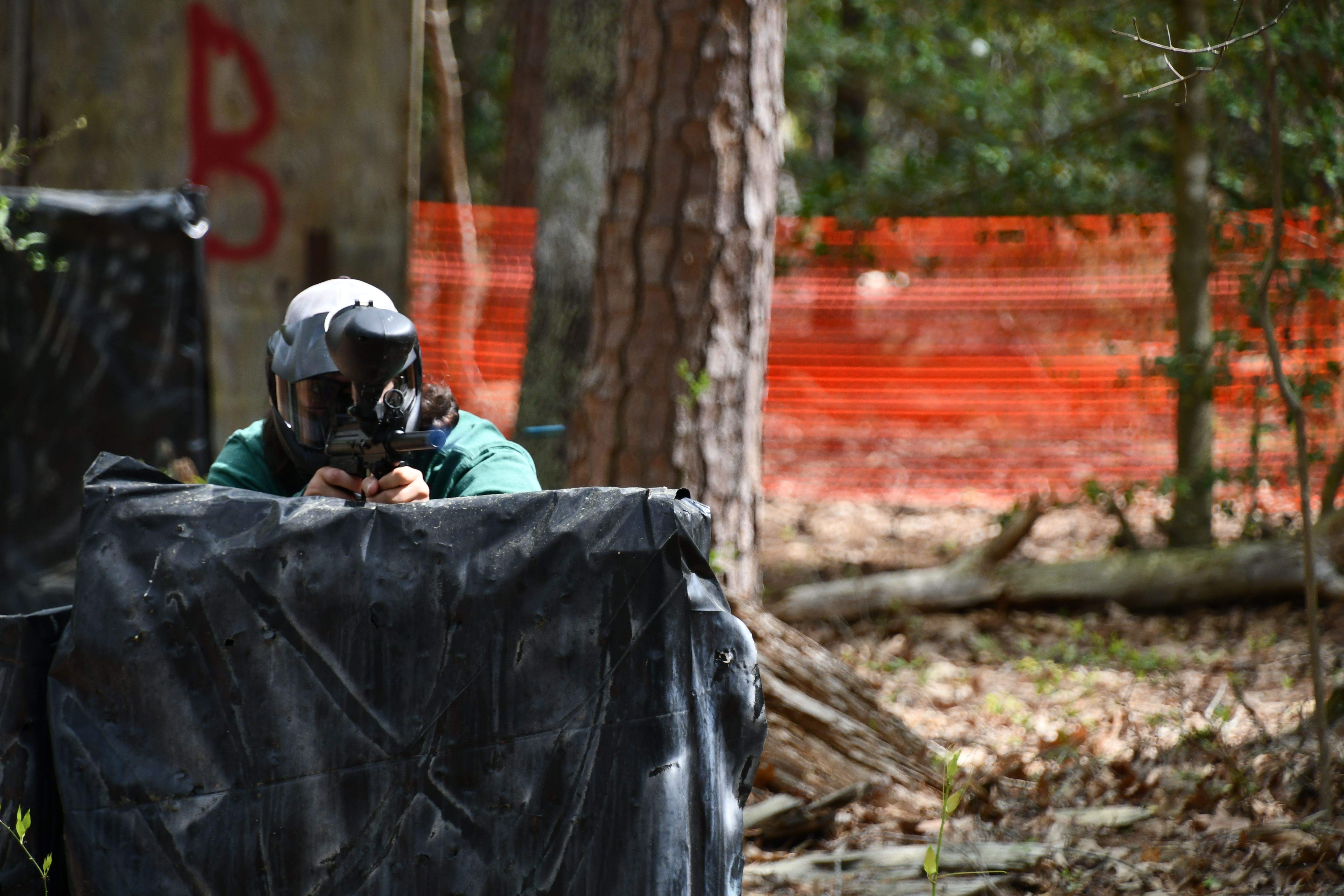  Cody Limbrick of the Department of Public Works fires a bright blue paintball at his opponent at Fort Walker’s grand re-opening of their paintball course on 17 April.