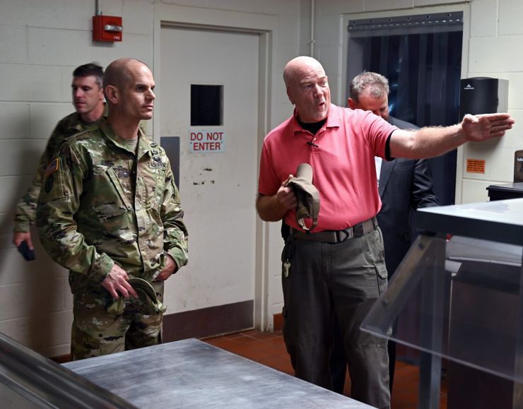 Barracks Manager Mr. Jay Poirier (right) briefed Brig. Gen. Omar J. Jones IV (left) at Wilcox Barracks during Jones' visit here today. Also shown is Fort A.P. Hill commander Lt. Col. Michael E. Gates (behind Jones) and Mr. Rich Salyers, Director of Plans, Training, Mobilization and Security. 