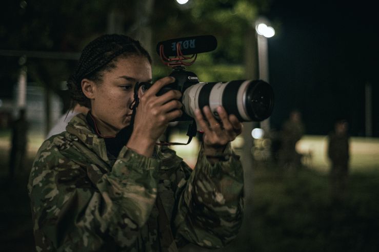 U.S. Army Pfc. Ebony Neal, documents service members competing in the 2022 Spc. Hilda I. Clayton Best Combat Camera Competition.j