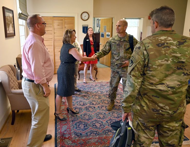 When Brig. Gen. Omar J. Jones IV (center) visited #fortaphill today he stopped by the garrison headquarters to meet the installation's directors. Shown here are: Ms. Marcella A. Norris, Director of the Logistics Readiness Center, Ms. Lisa E. Skinner (shaking hands with Jones), Director of Resource Management, Director of Emergency Services David N. Carey and Fort A.P. Hill commander Lt. Col. Michael E. Gates