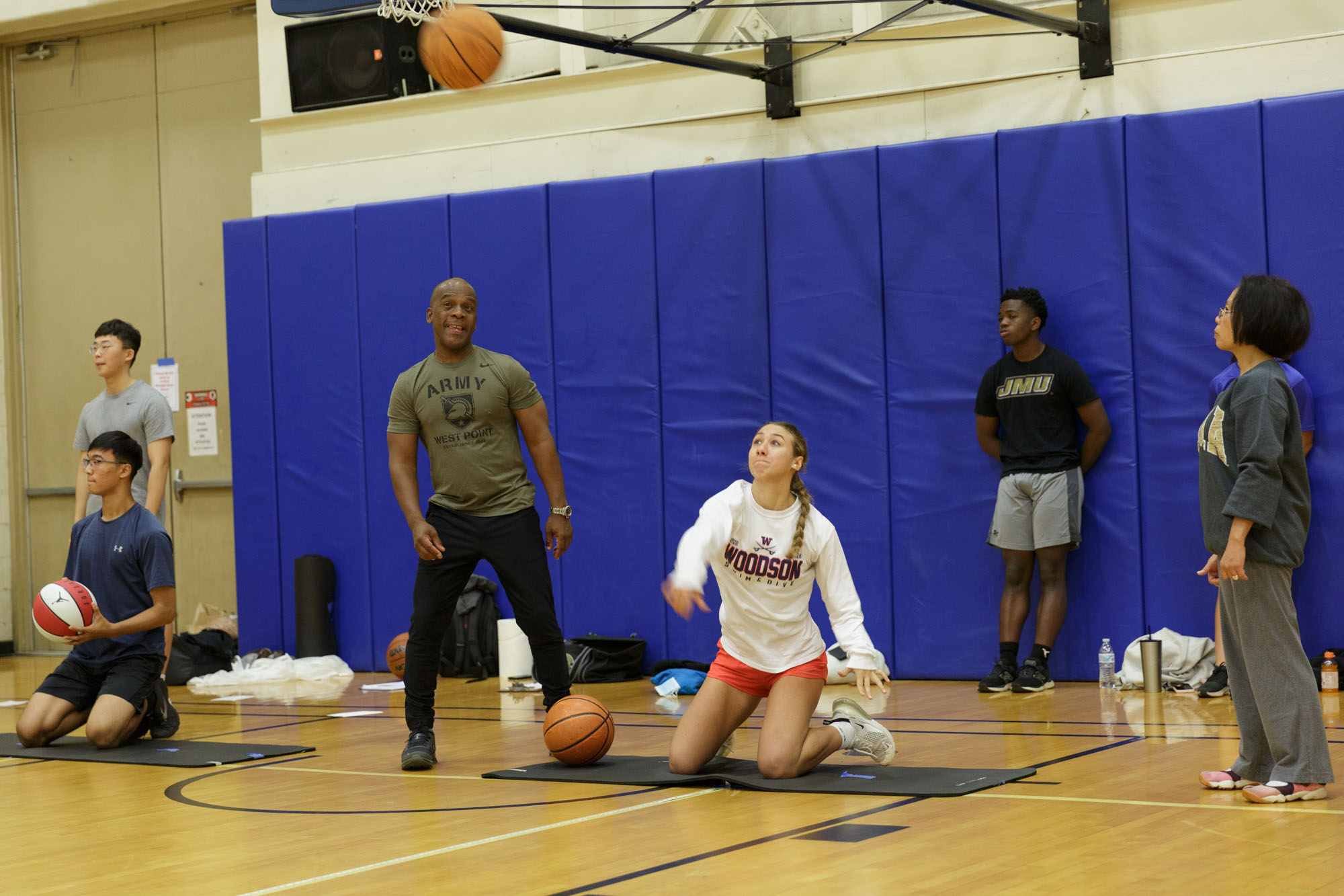 Zosia Ridley throws a basketball during Candidate Fitness Assessment