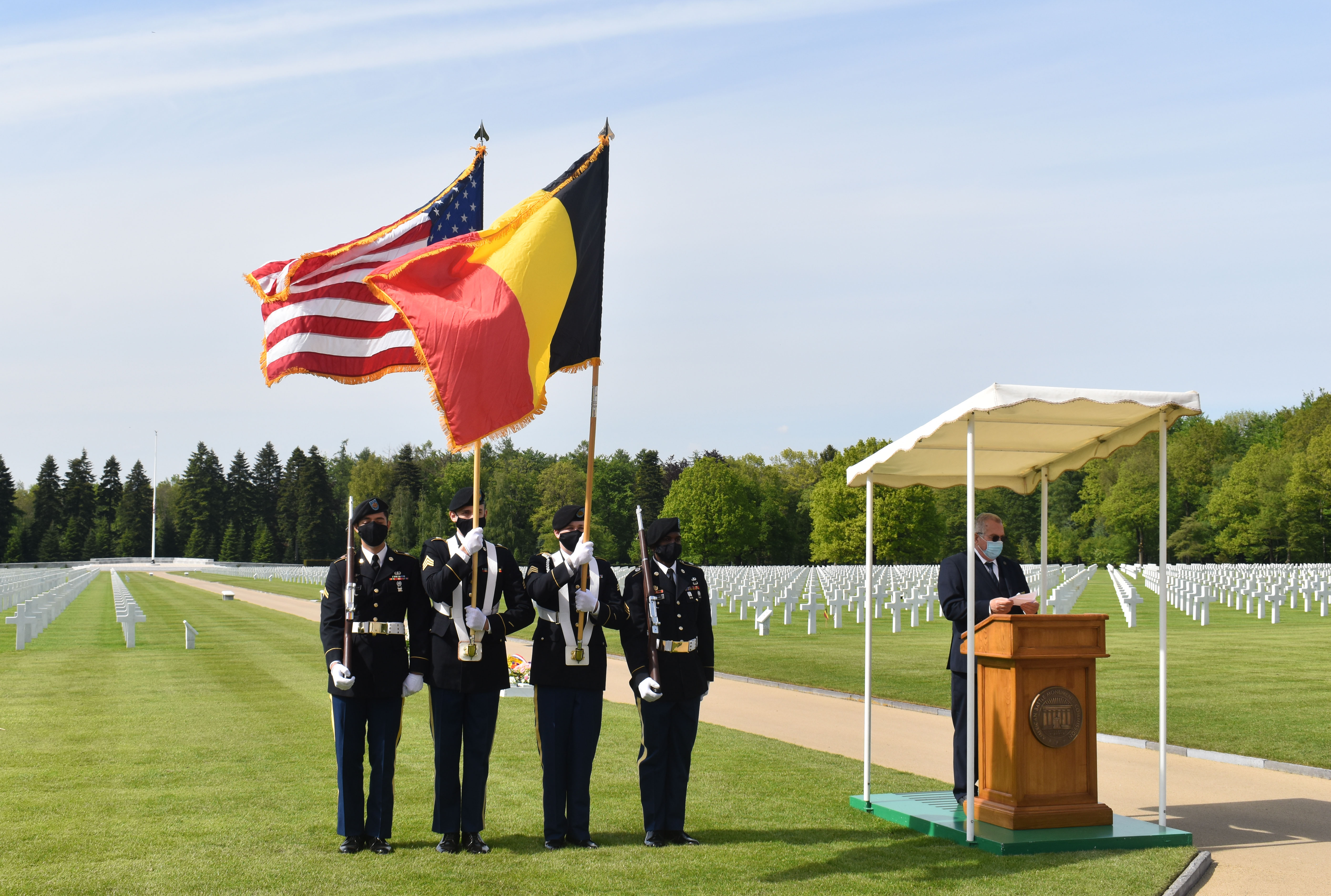 A photograph of a color guard at a ceremony