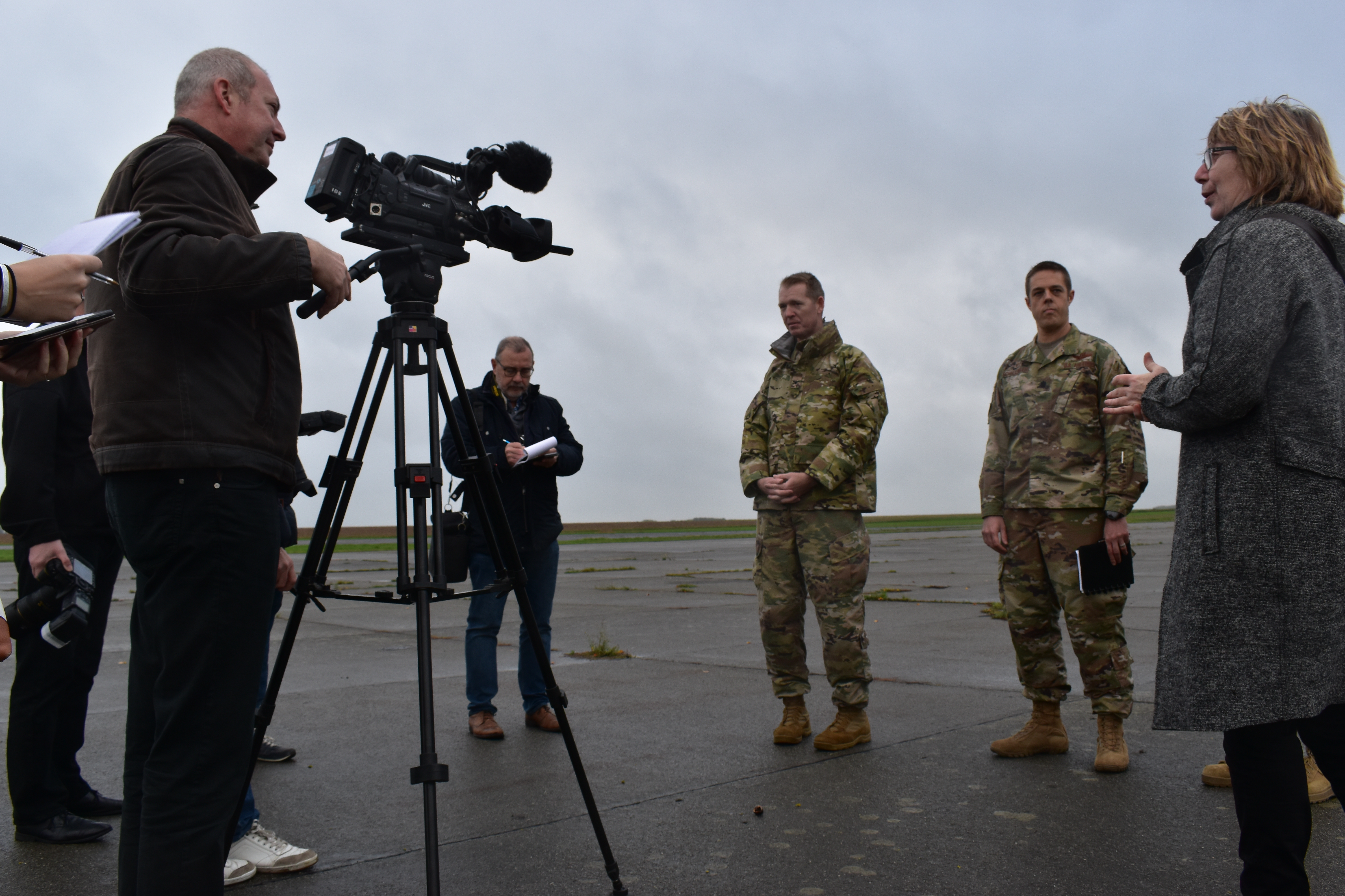 A photograph of a media crew doing an interview