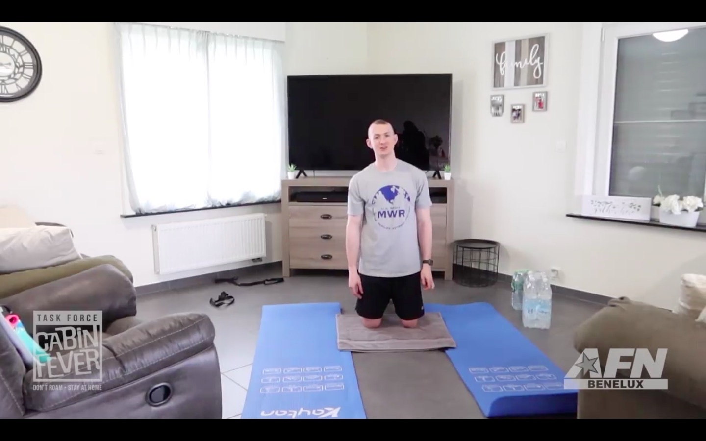 BRUSSELS -- Sgt. Brian Caulkins, Public Health Activity - Rheinland-Pfalz in Germany, demonstrates how to set up a workout area at home. The video is part of a series of content that Task Force Cabin Fever has been providing garrison community members following the implementation of stay-at-home measures in Belgium, Germany and the Netherlands. (Screenshot from video by Task Force Cabin Fever) TF Cabin Fever 2.jpg