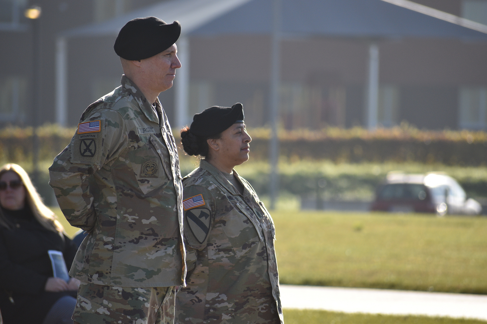 A photograph of a man and woman standing at attention
