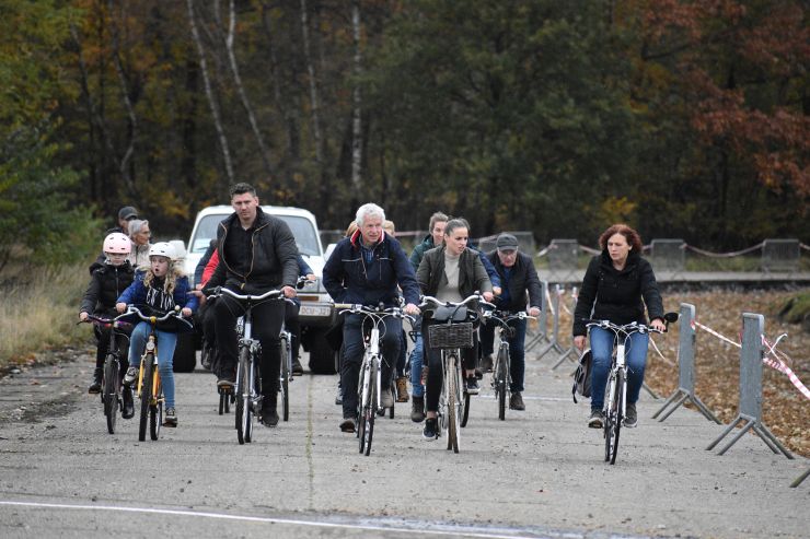 A photograph of people on bikes