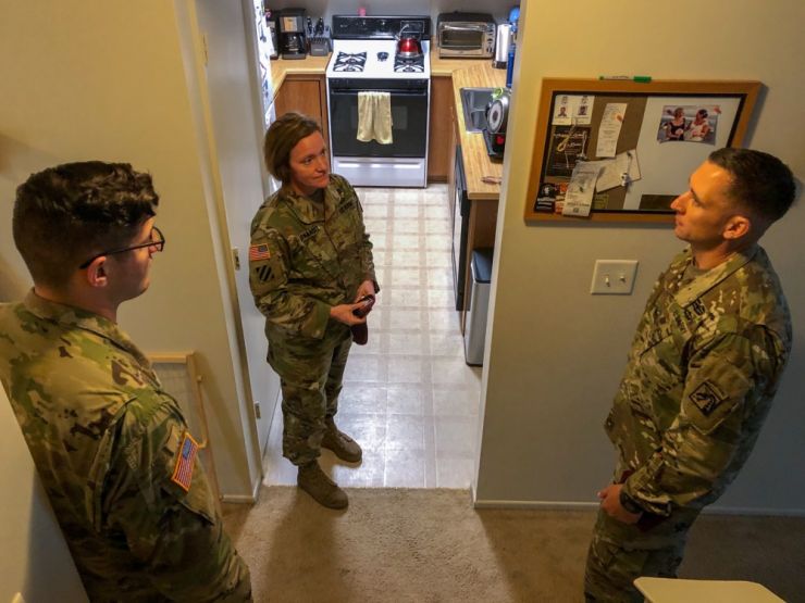 Leadership meeting with their Soldiers to help address housing issues they may have have