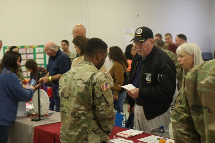 U.S. military retirees, spouses, and the Family members talk with various agencies and vendors during the annual Retiree Appreciation Day on Oct. 1, 2022.