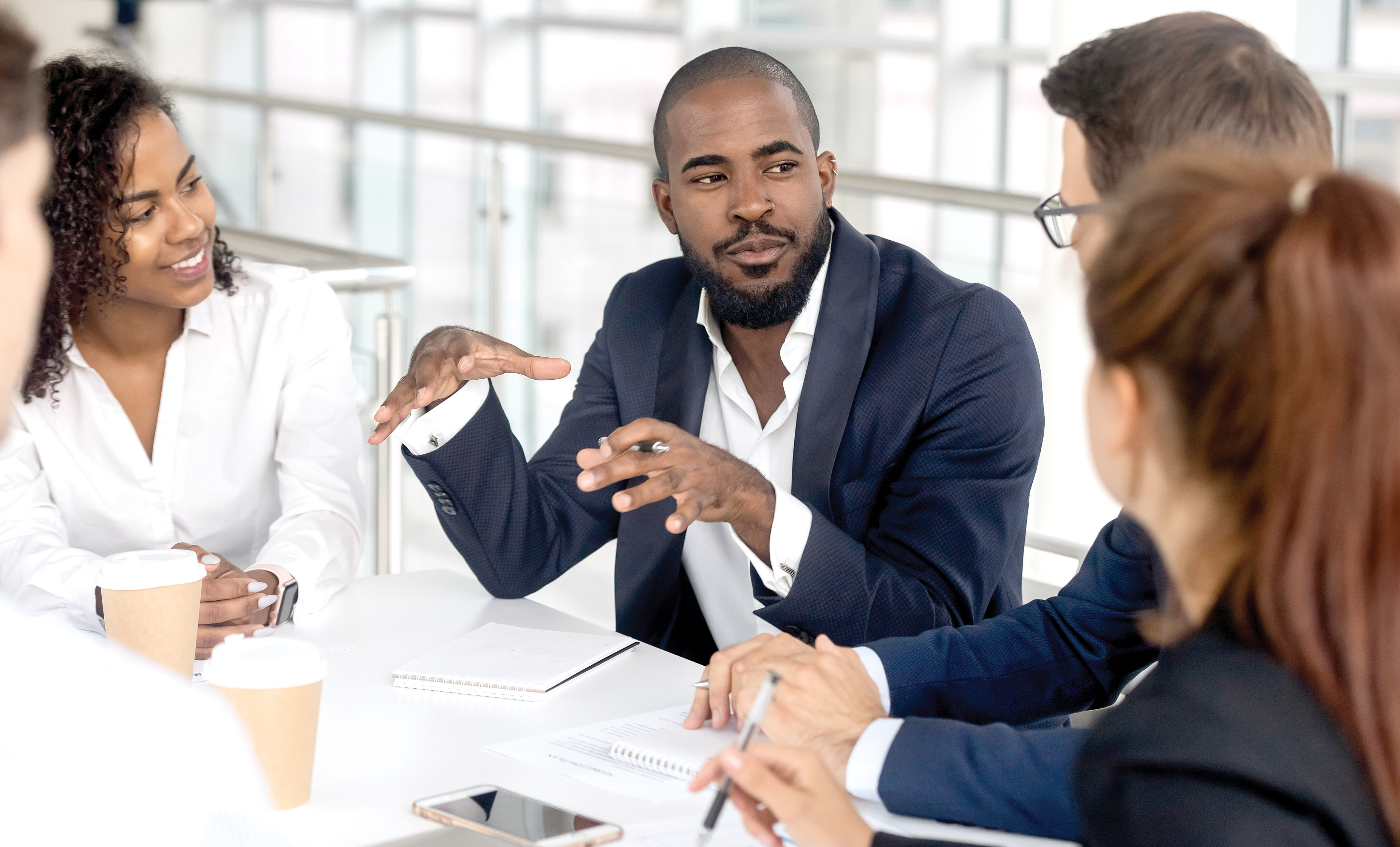 Employees around table