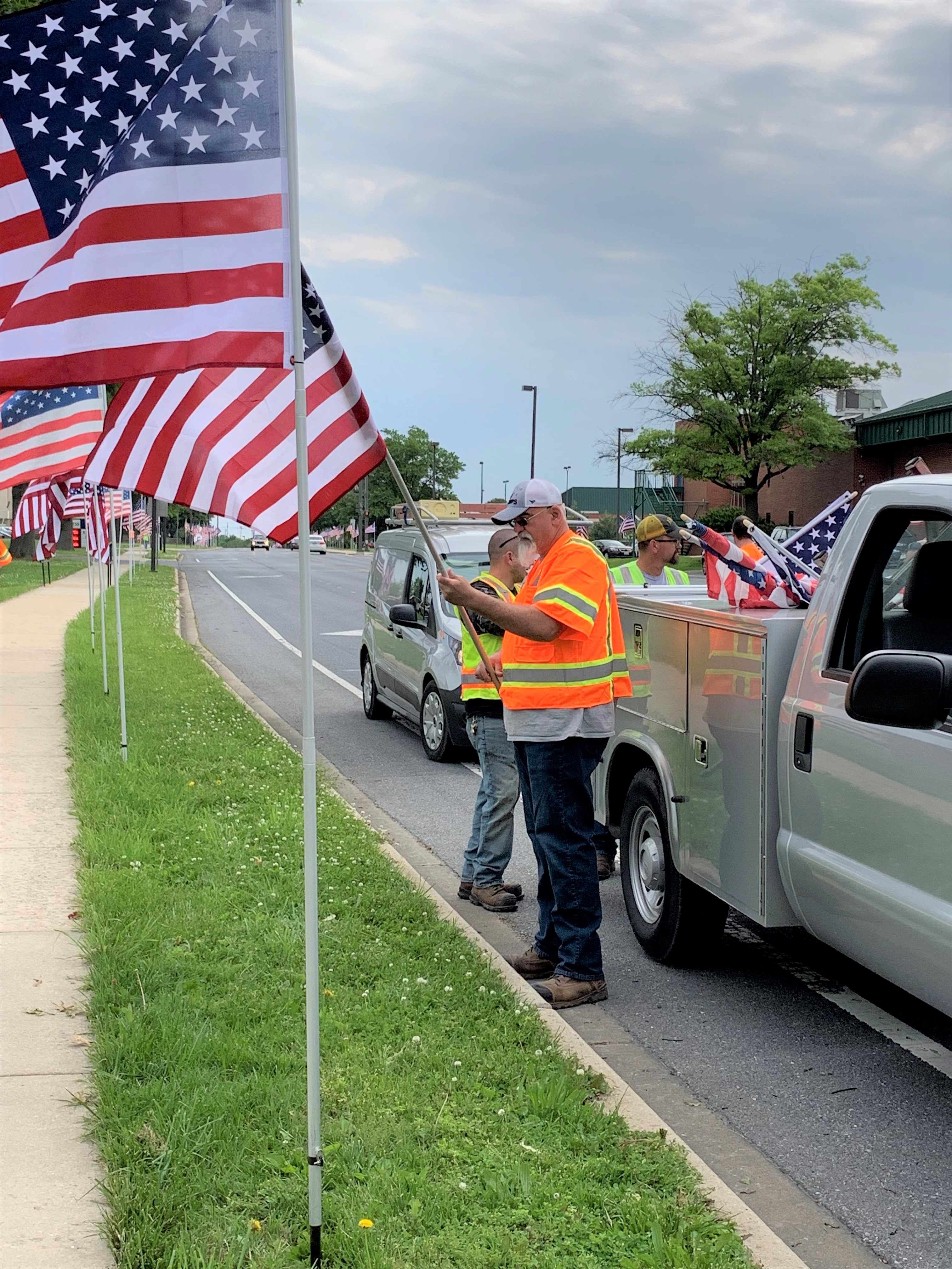 DPW installing flags along Porter Street