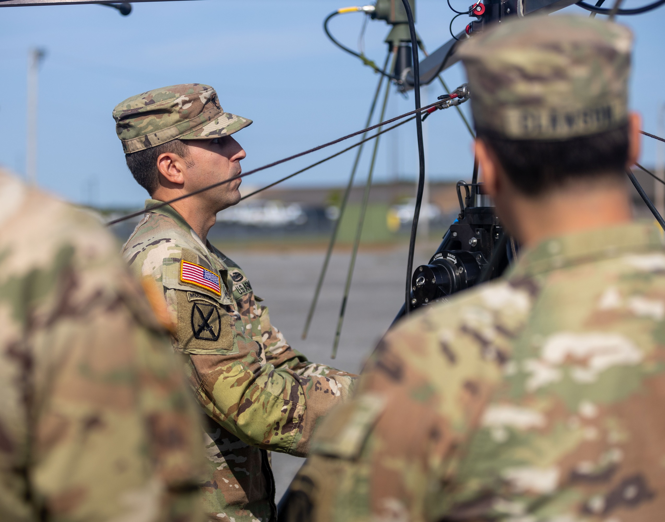 A Soldier assembles a ground antenna during an exercise on Fort Drum.