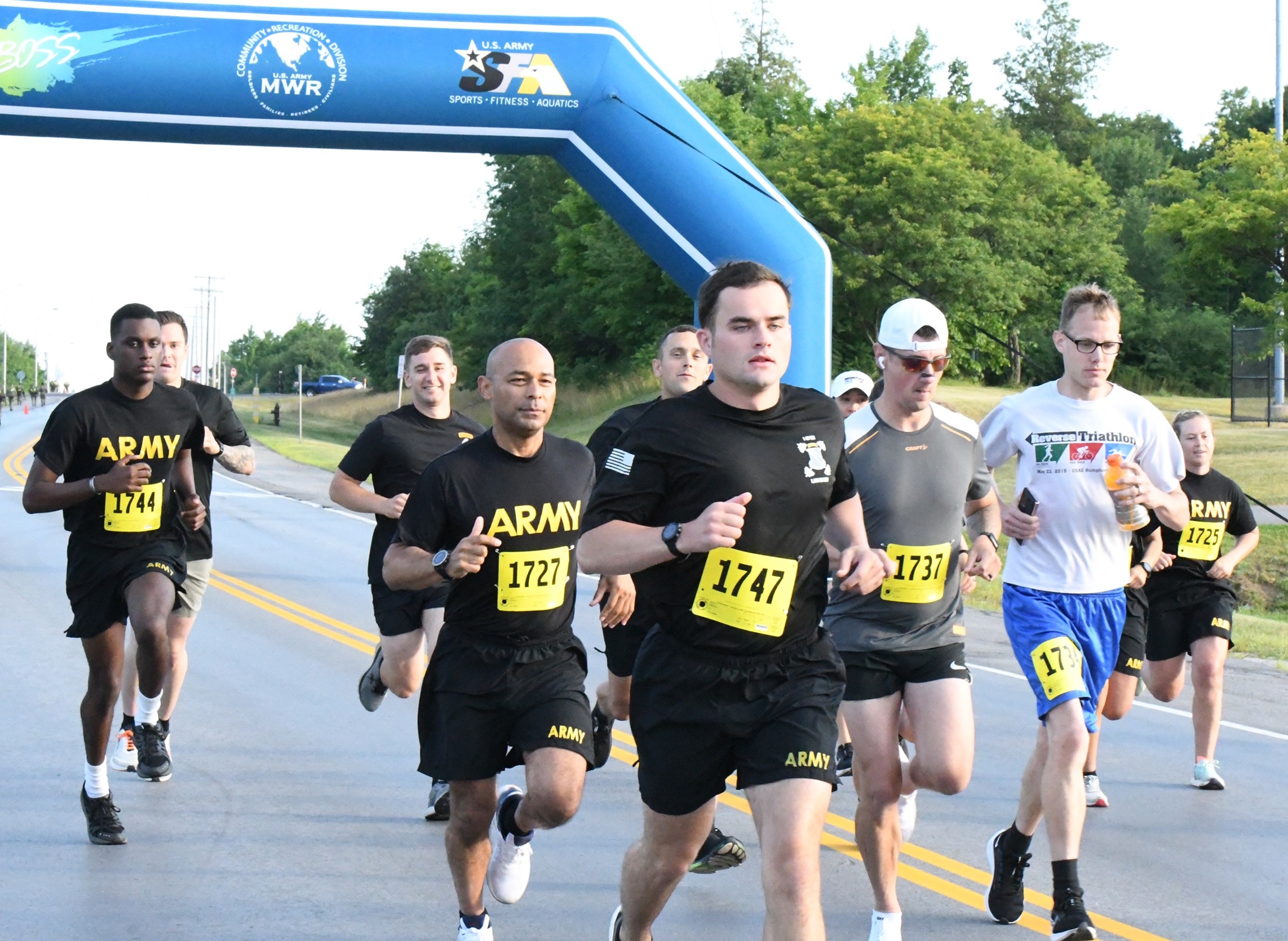 Soldiers run away from start line in Fort Drum Army Ten Miler Qualifier.