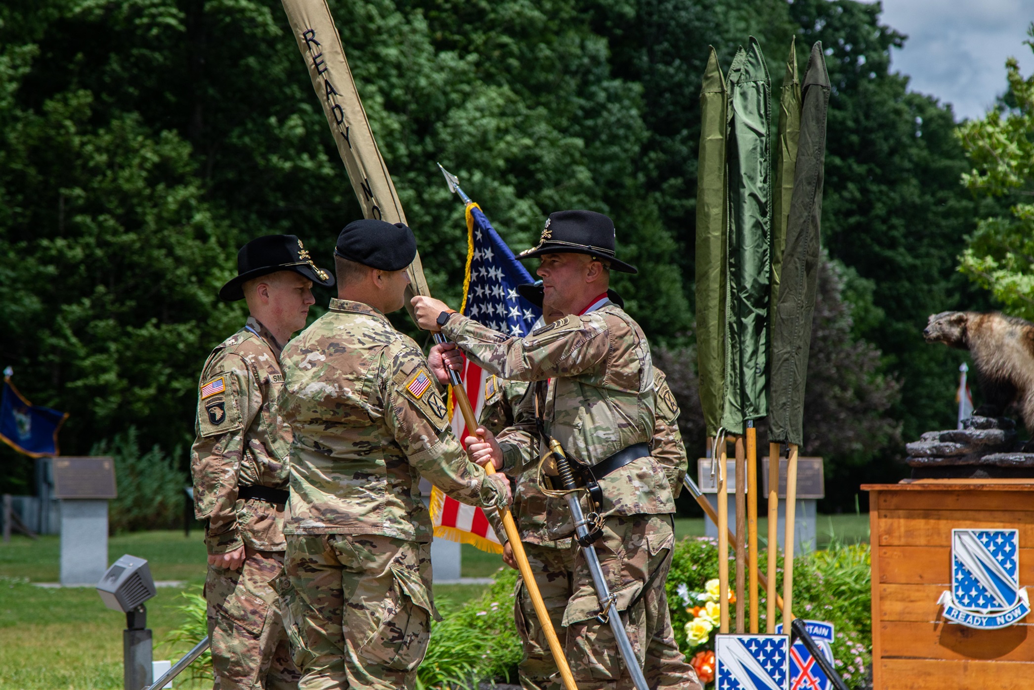 Commander hands 1-89 Cavalry guidon to 2nd BCT commander during ceremony