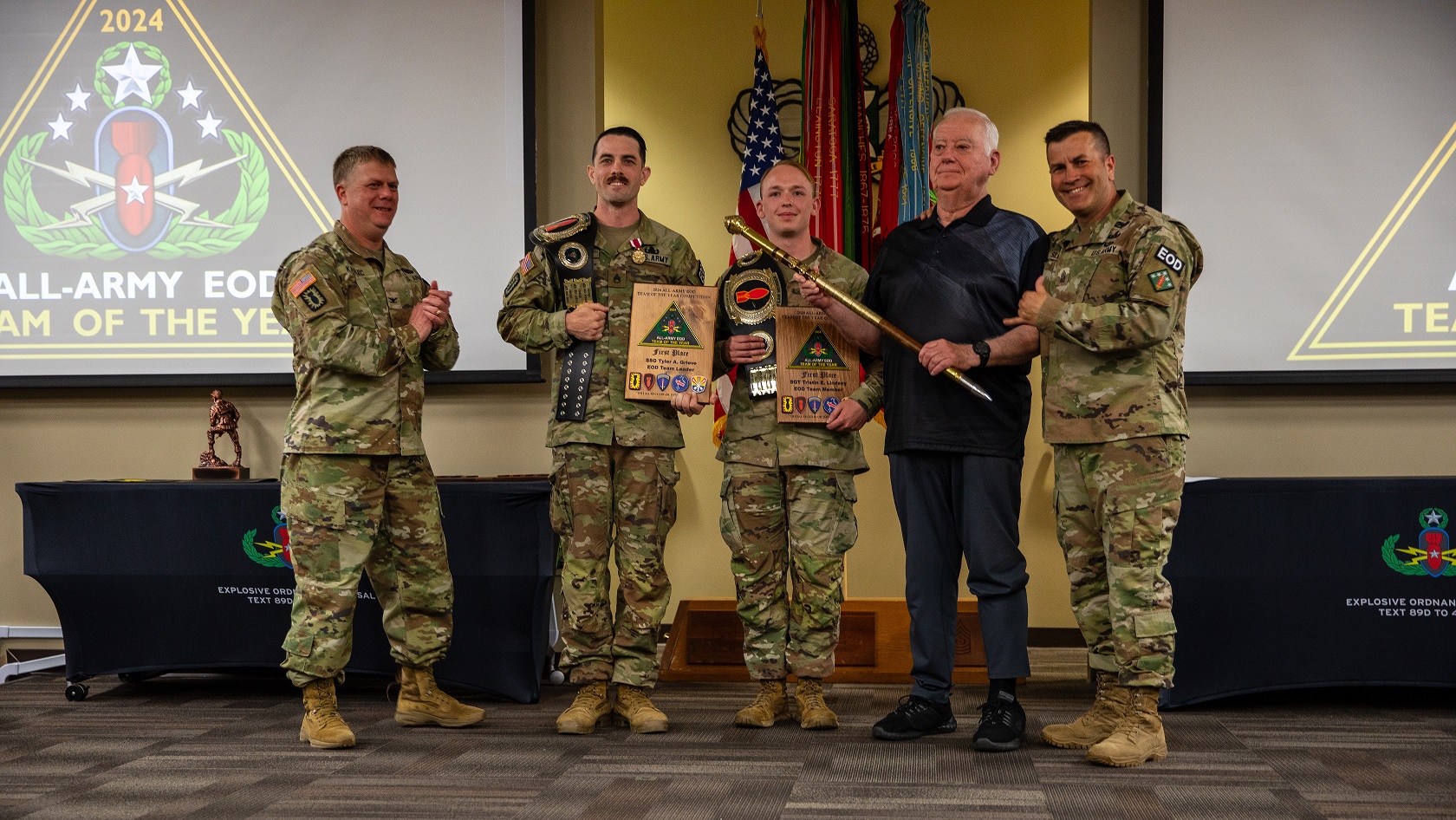 Five Soldiers - two with awards -stand together at All-Army EOD Competition