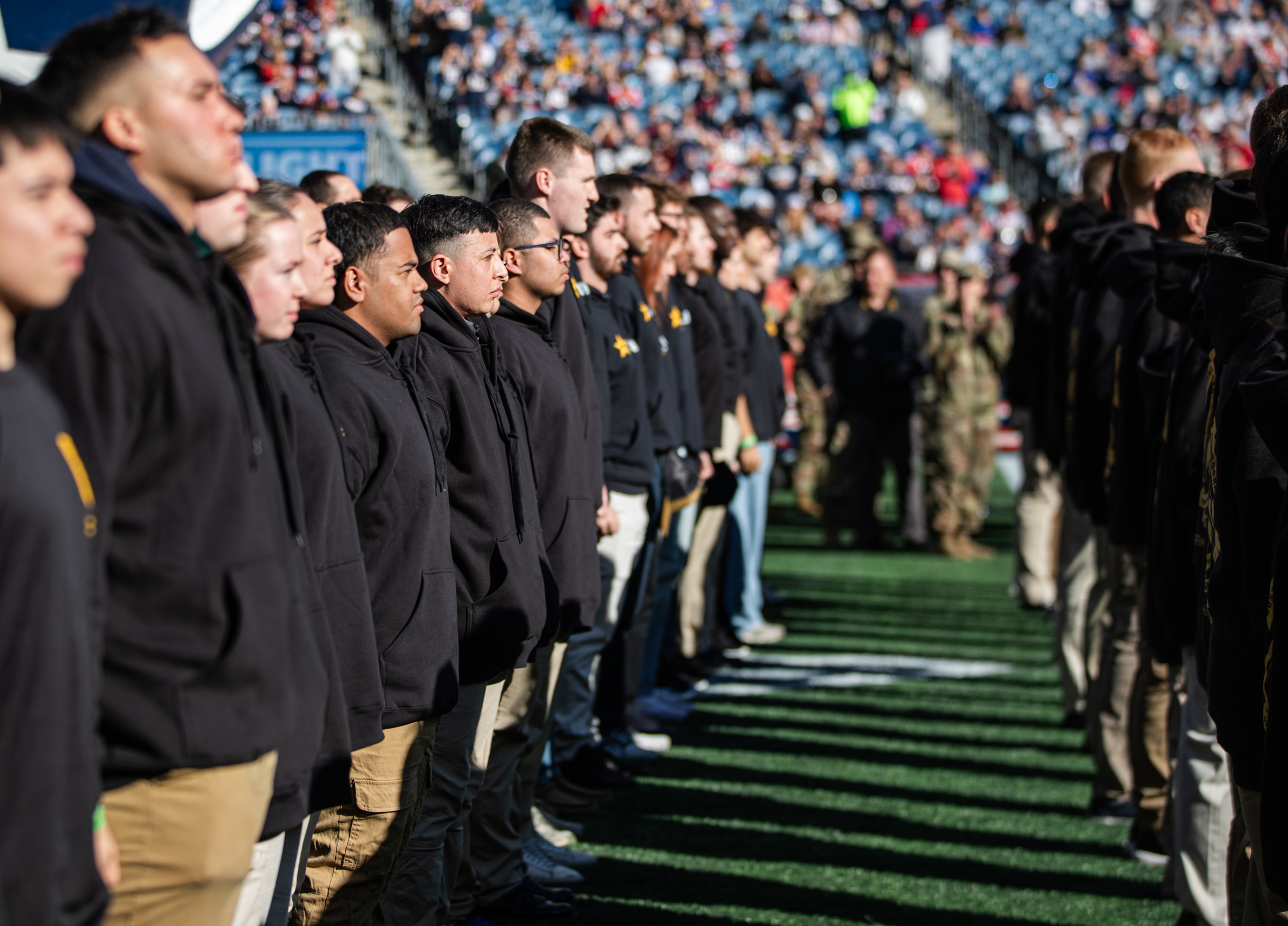 Future recruits from all military branches prepare to take the oath of enlistment.