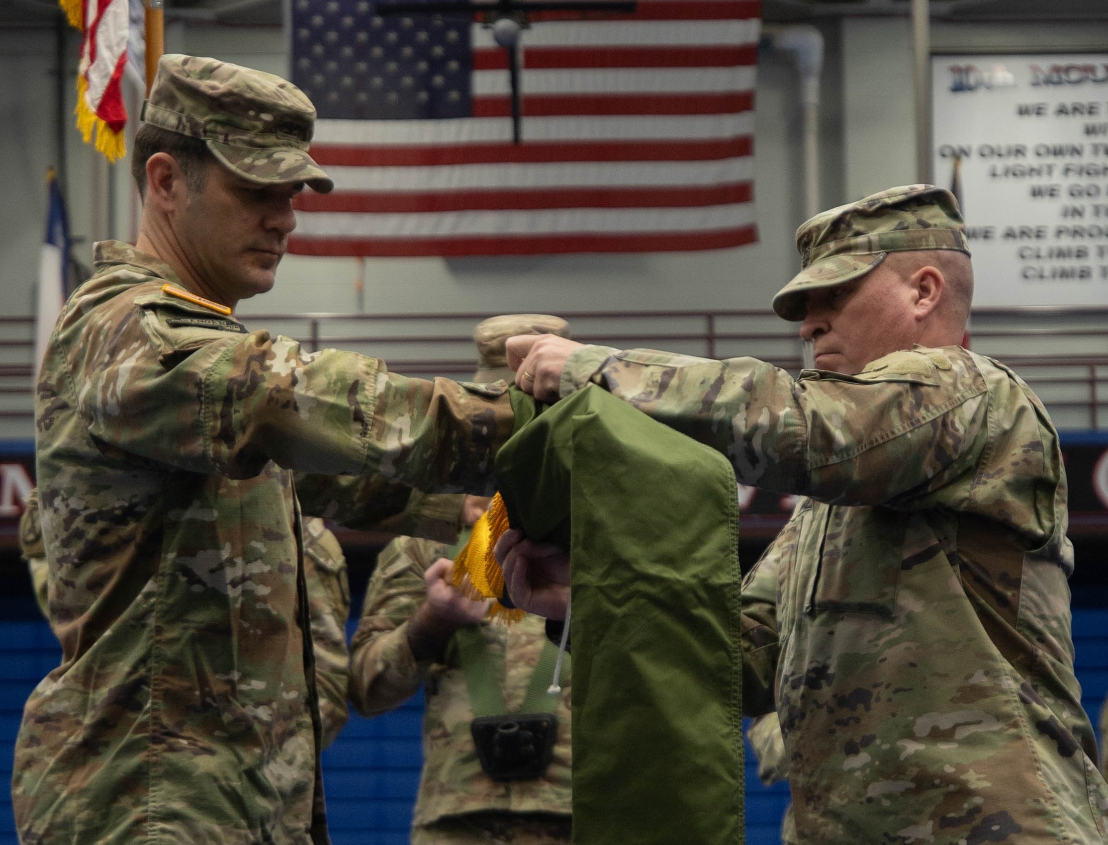 Leaders case 1st Brigade Combat Team colors ahead of deployment.
