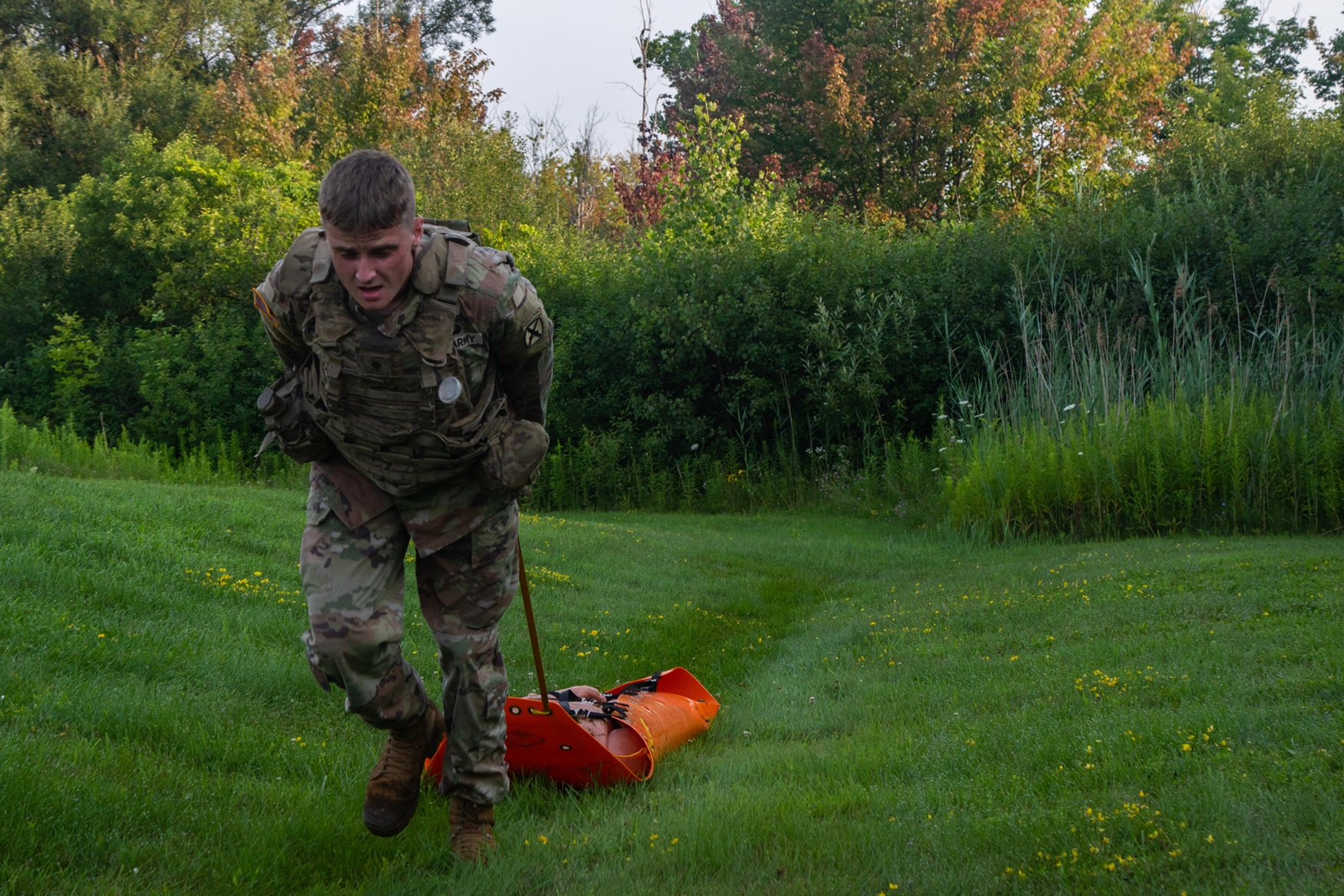 Soldier participates in a a 25-meter casualty evacuation lane.
