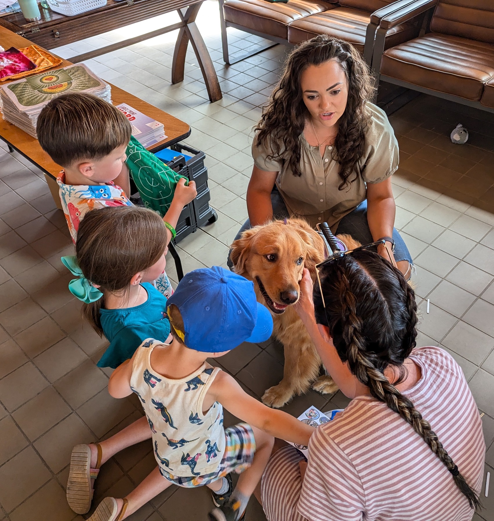 A family meets Charlie the therapy dog at Chill Fest.