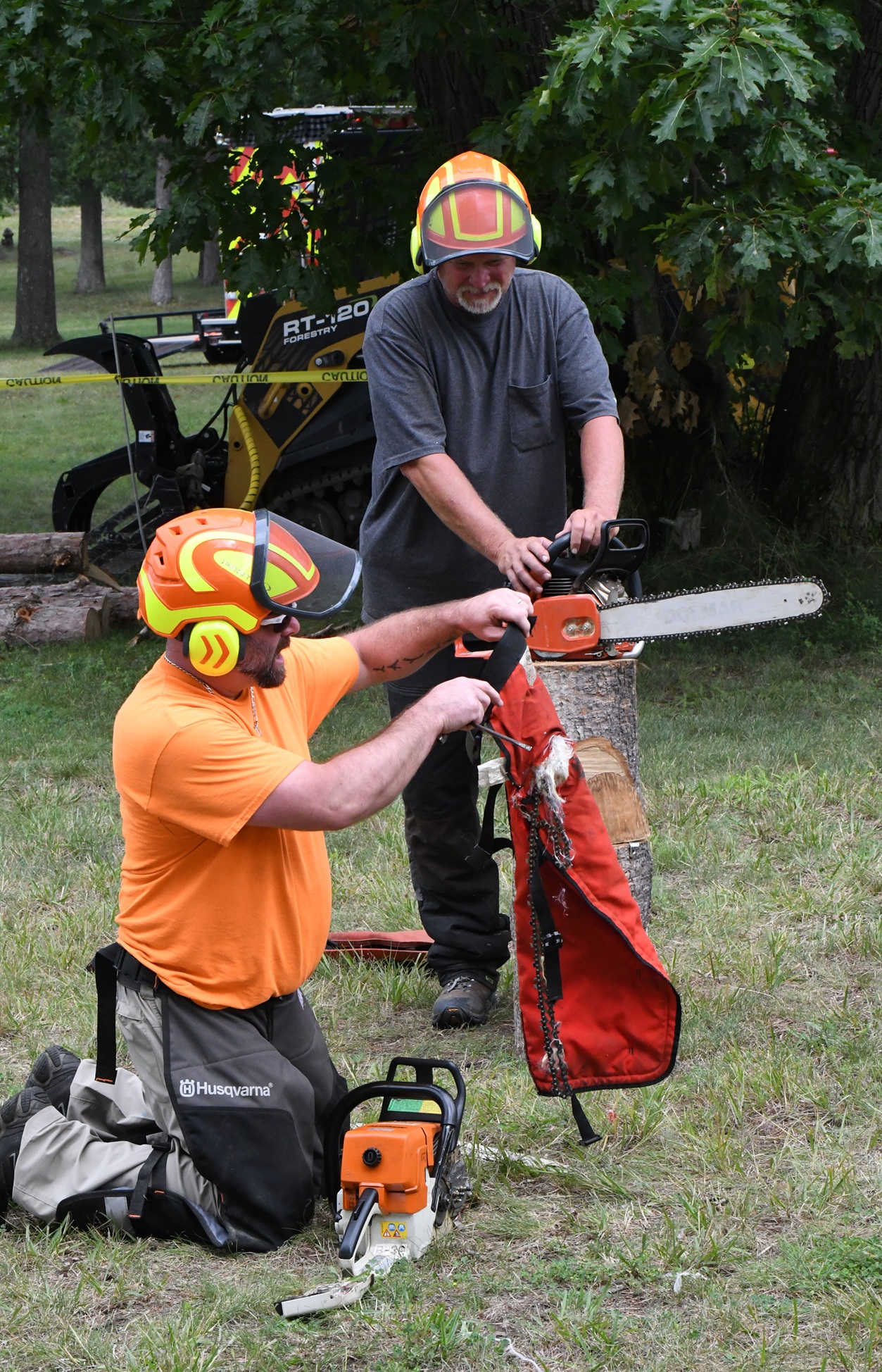 Foresters give chainsaw demonstration during 2024 Outdoor Adventure Day.