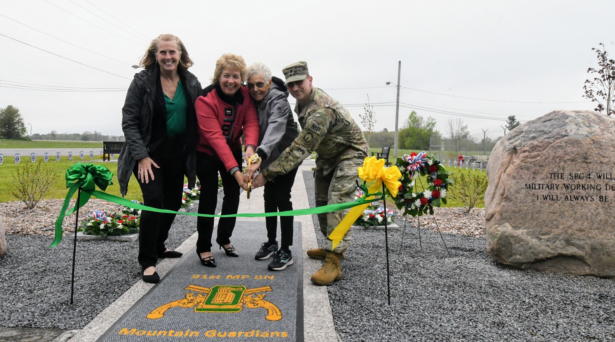Three women - one male Soldier run ribbon for Military Working Dog Memorial.