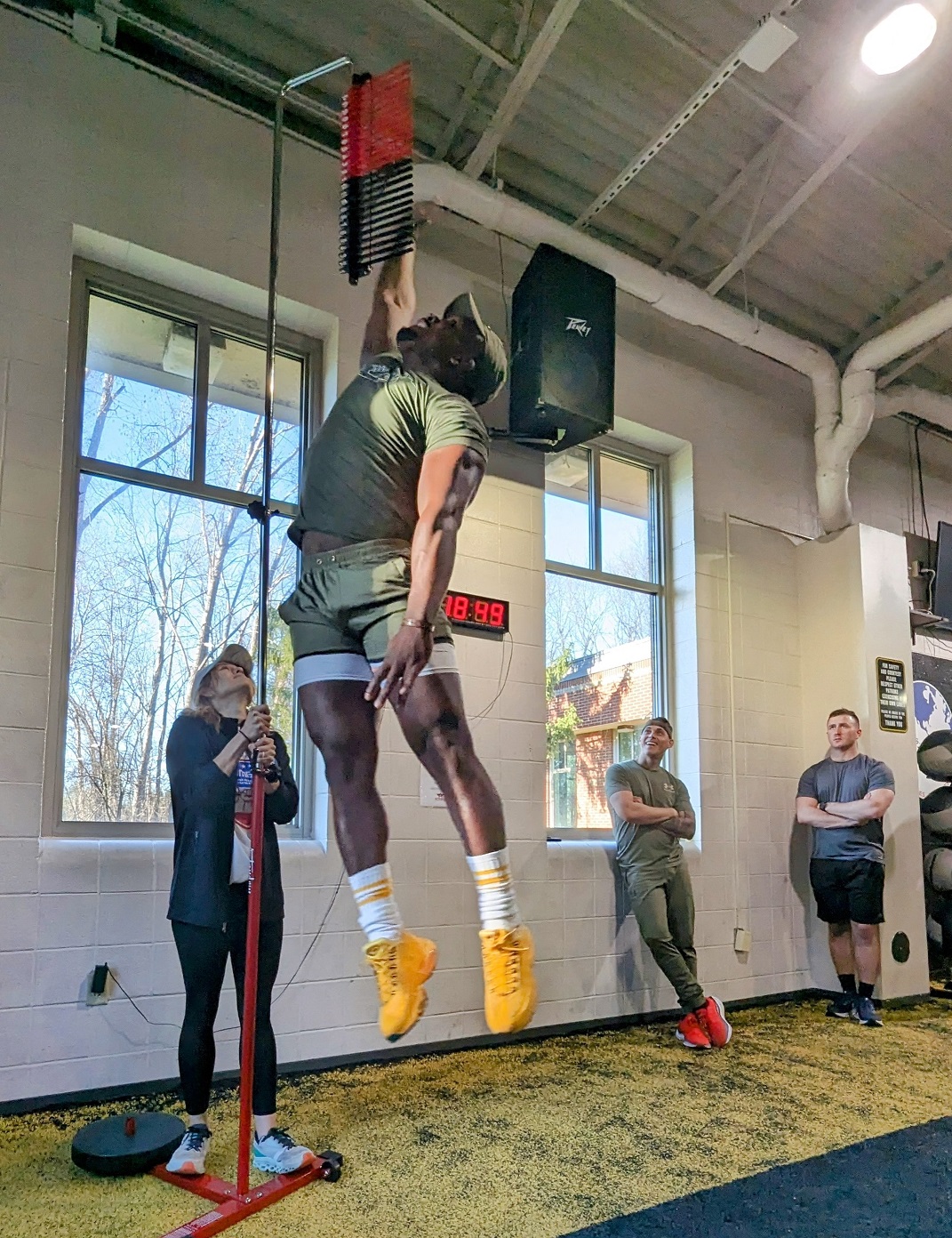 Soldier reaches up for the vertical jump test.