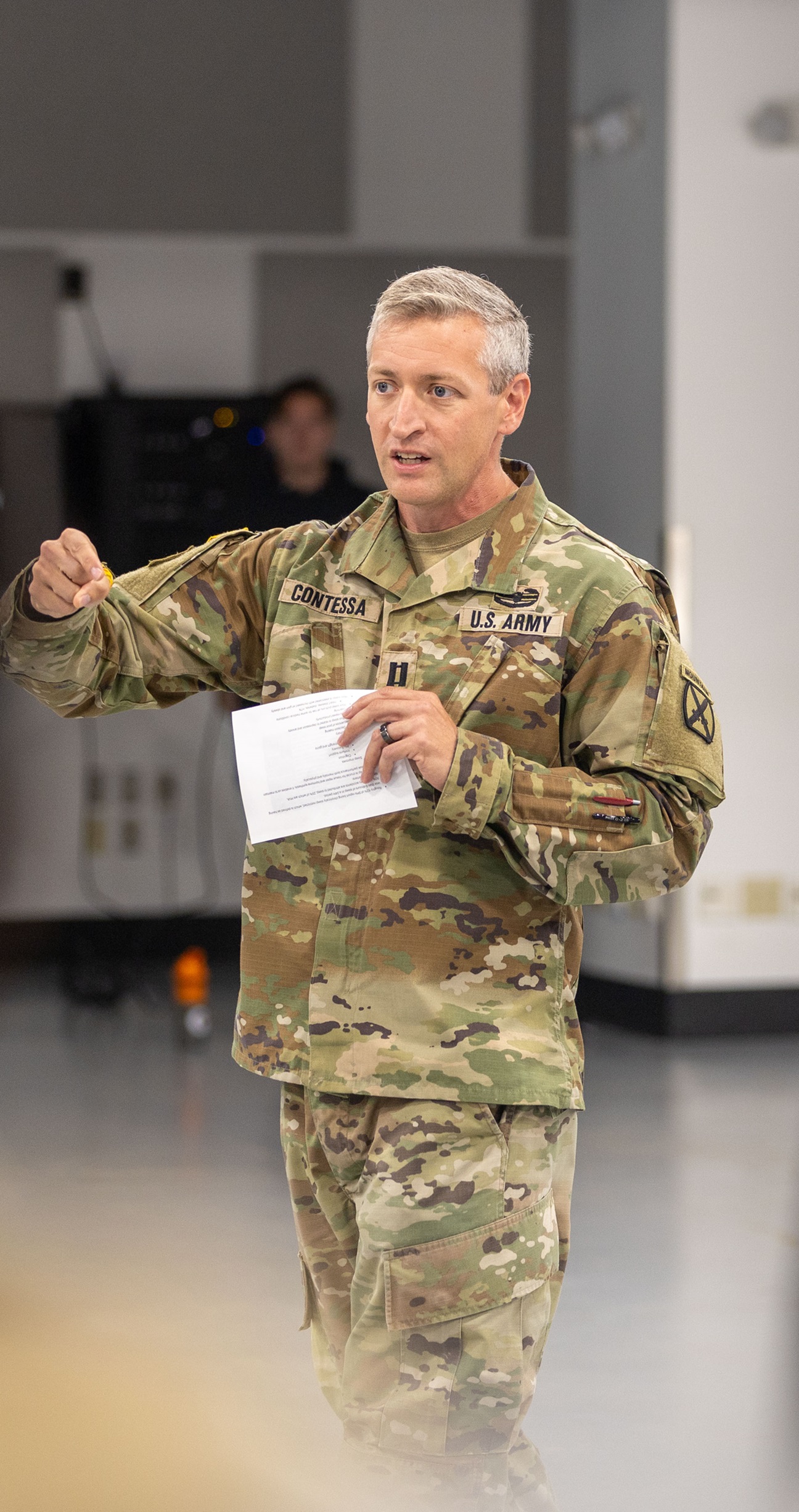 Officer instructs Soldiers on Health and Holistic Fitness.