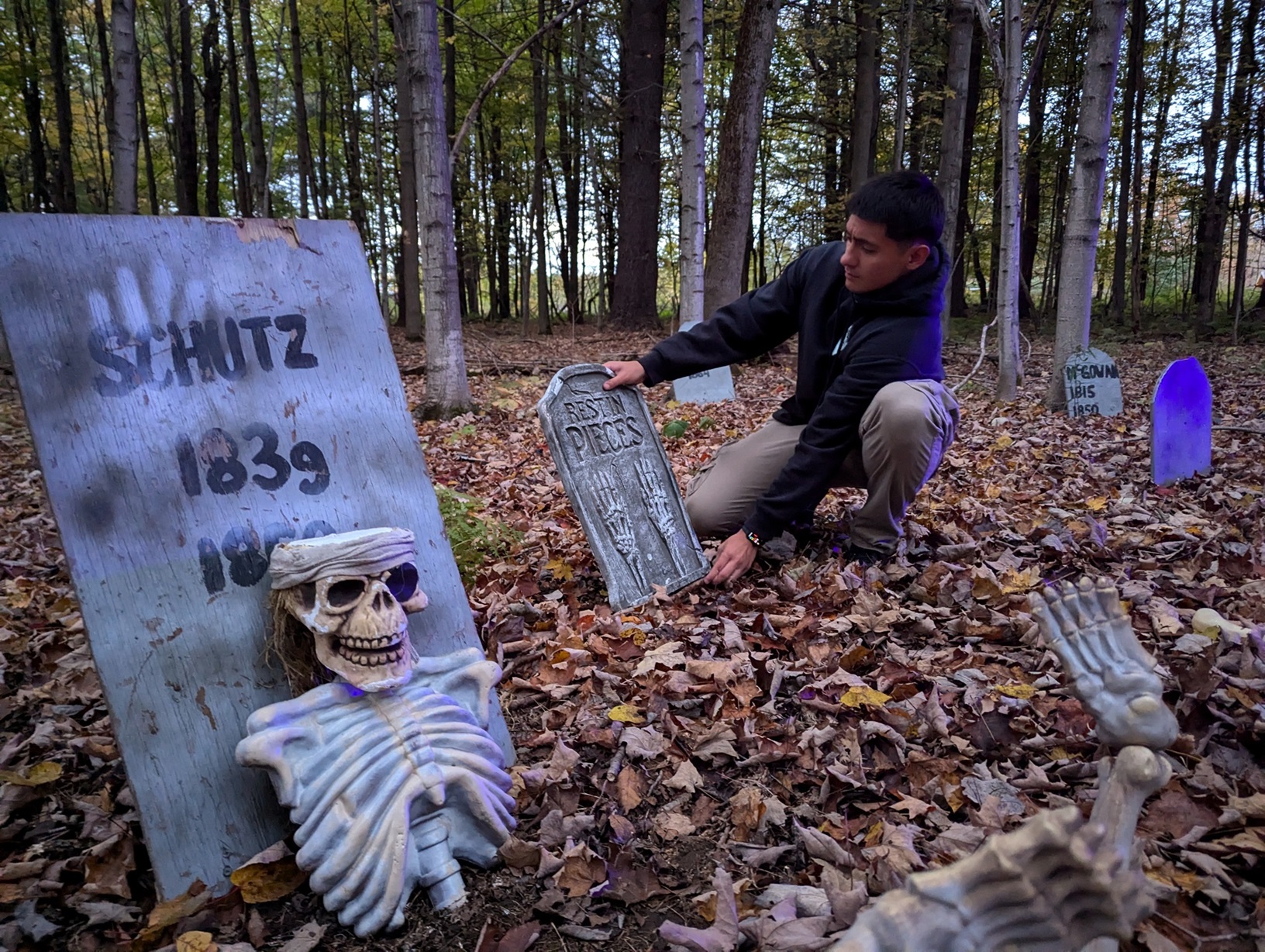 Fort Drum BOSS president works on a scene for the Haunted Trail in Remington Park.