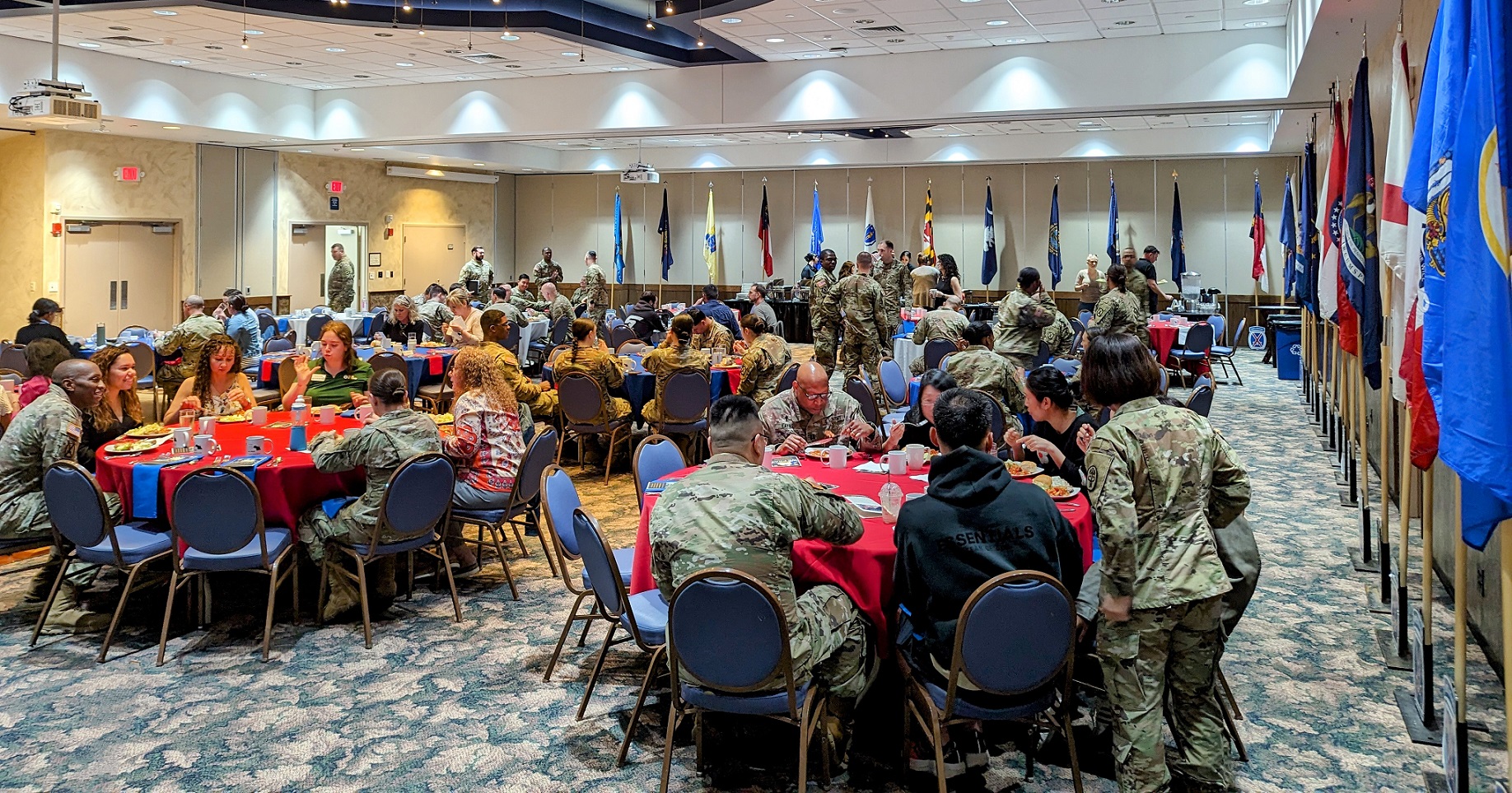 Soldiers and civilians sit at tables for National Day of Prayer Luncheon.