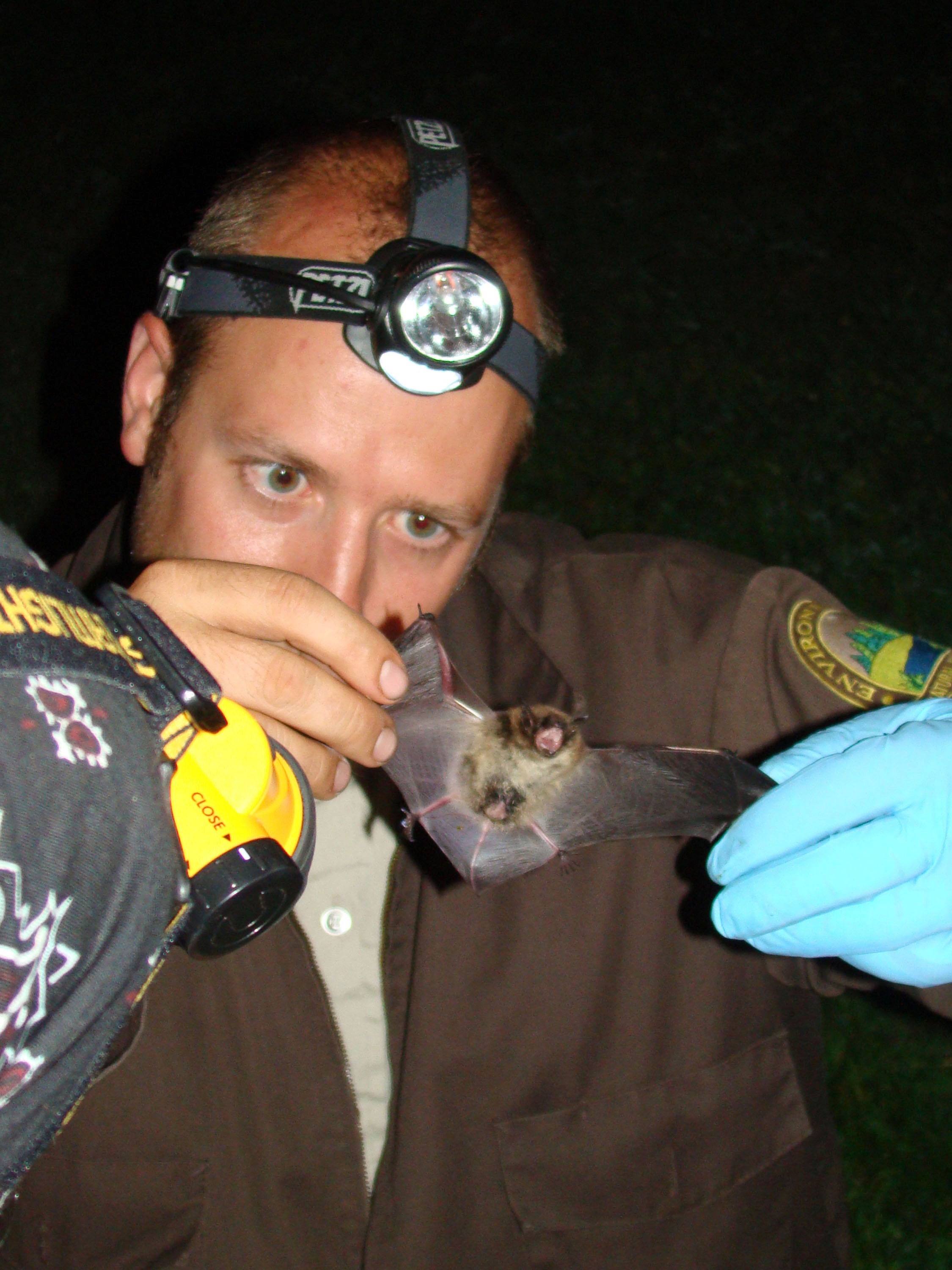 Chris Dobony inspects bat.jpg