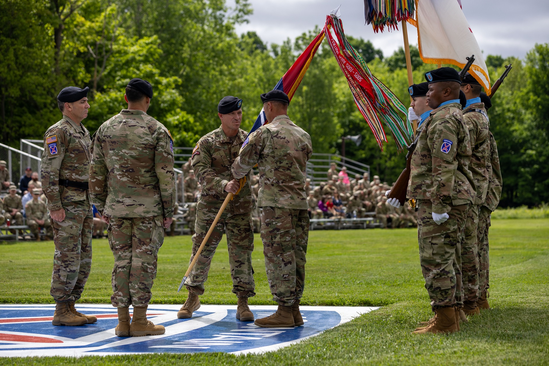 CSM Brett Johnson passes division guidon during change of responsibility