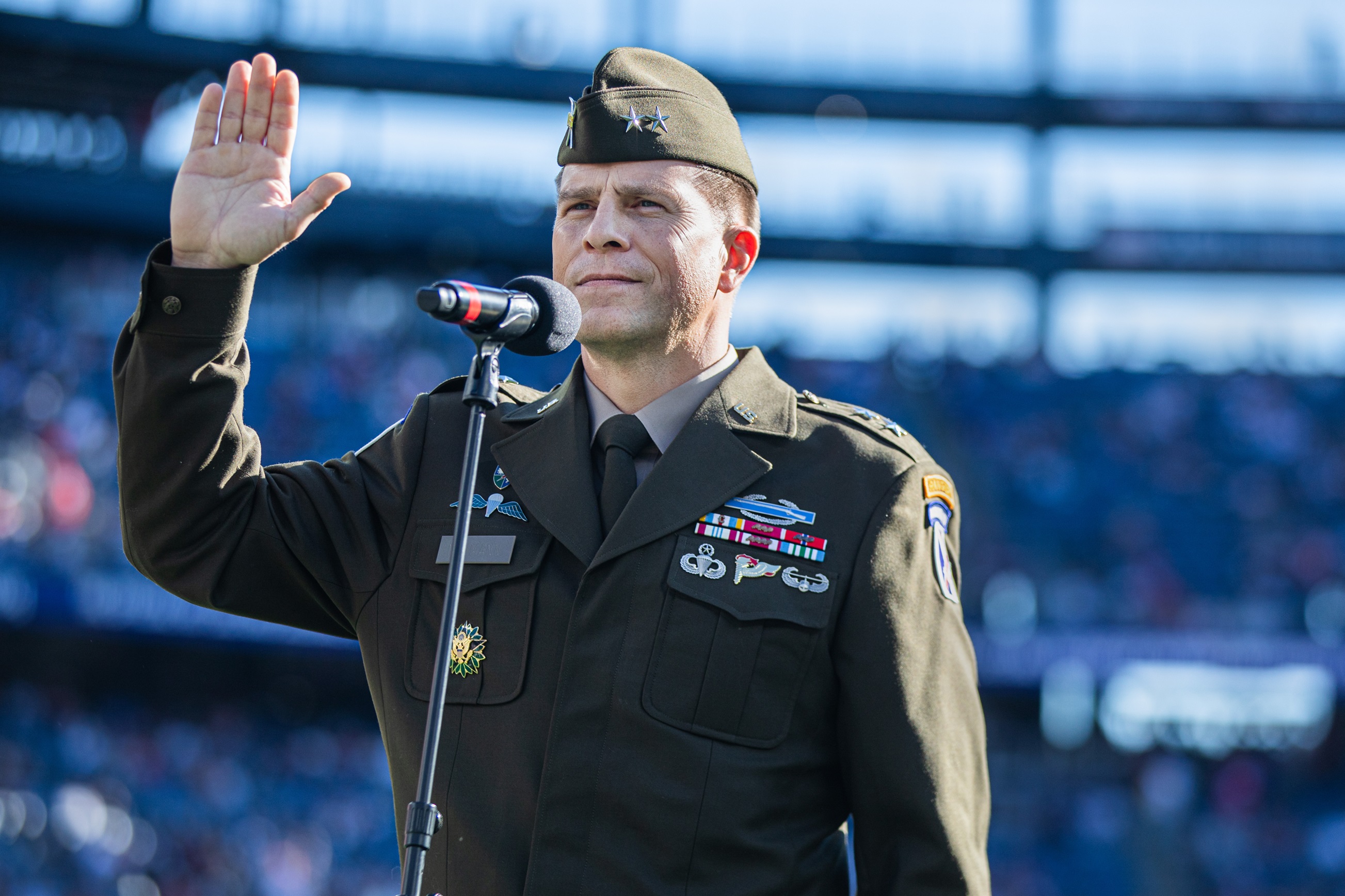 Maj. Gen. Scott Naumann administers the oath of enlistment to future military service members.
