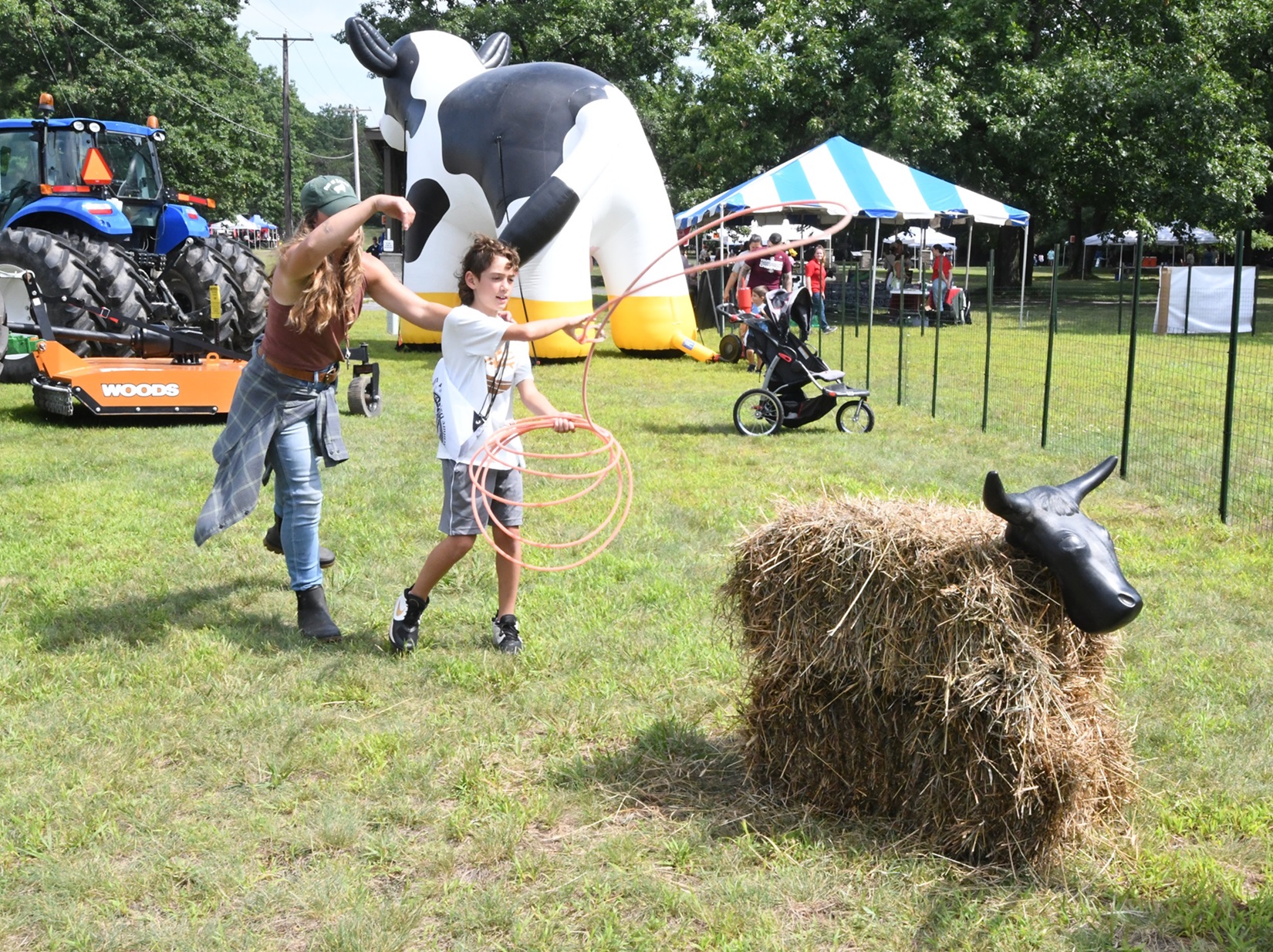 Boy tries his hand at roping a "calf" during 2024 Outdoor Adventure Day. 