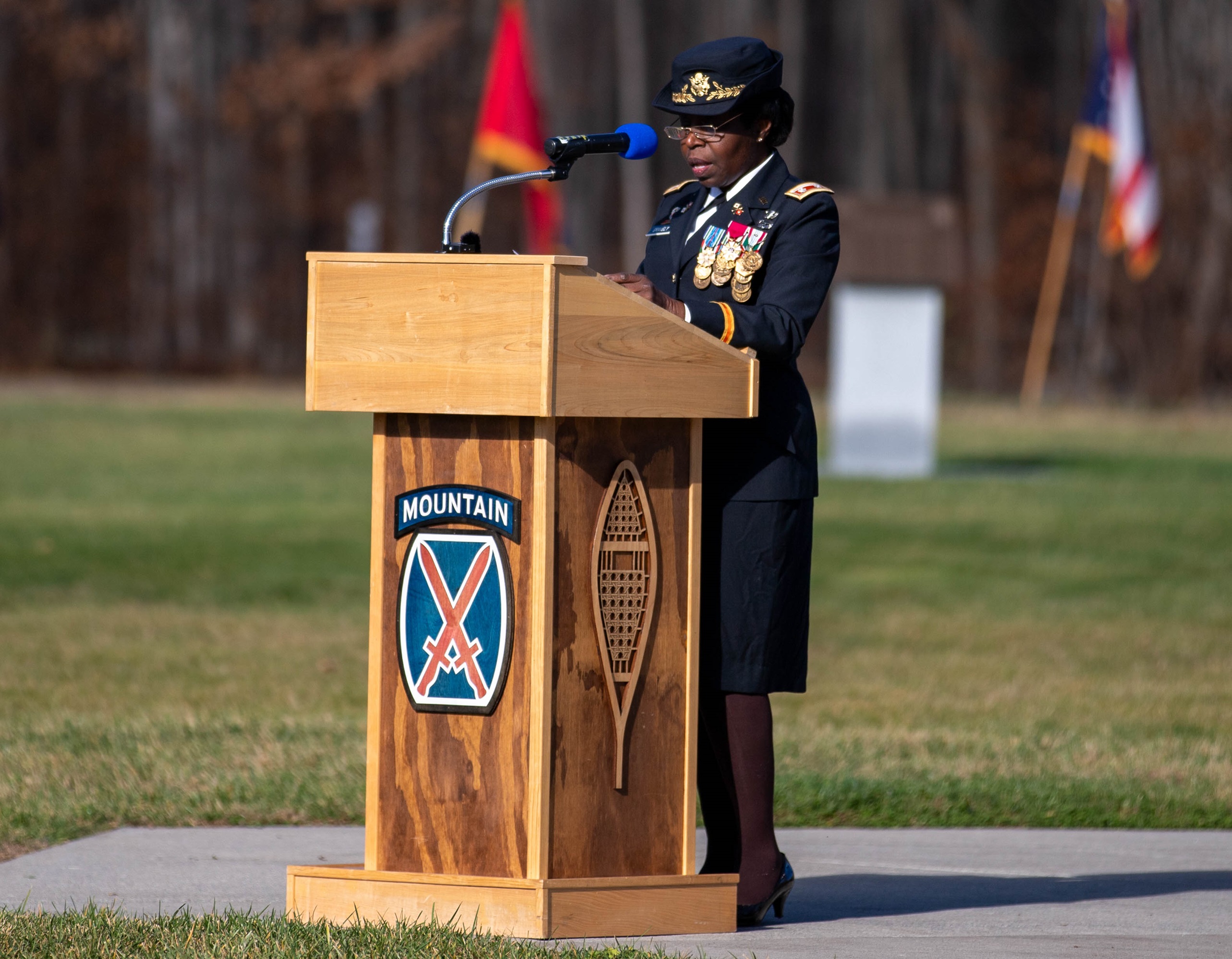 Female Soldier addresses audience during Veterans Day 2024 cermeony.