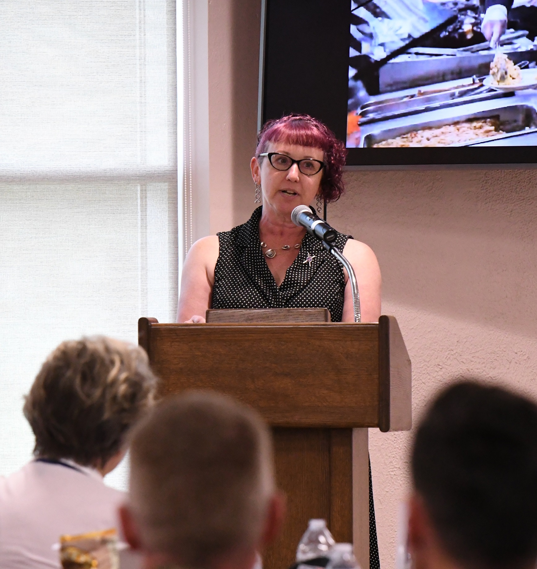 Keli Schmid, Hall of Fame inductee, addresses audience.