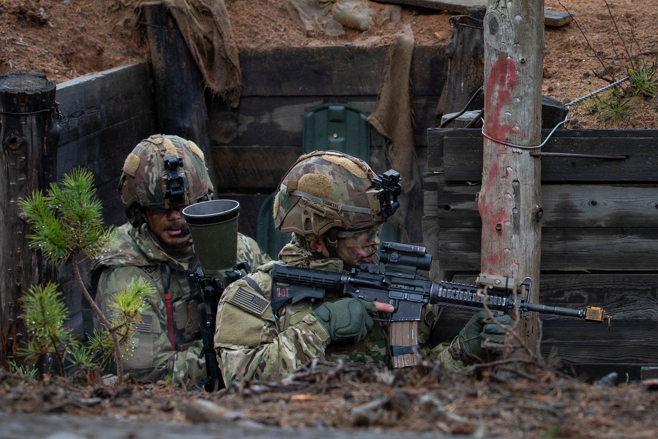 Two Soldiers clear a trench during a live-fire exercise in Estonia.
