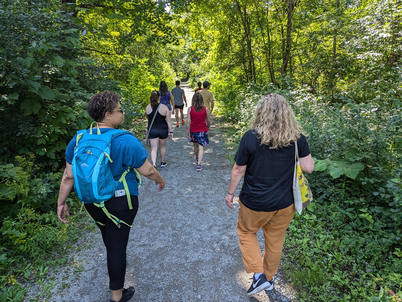 Community members enjoy a Mindfulness Walk along a wooded trail on Fort Drum.