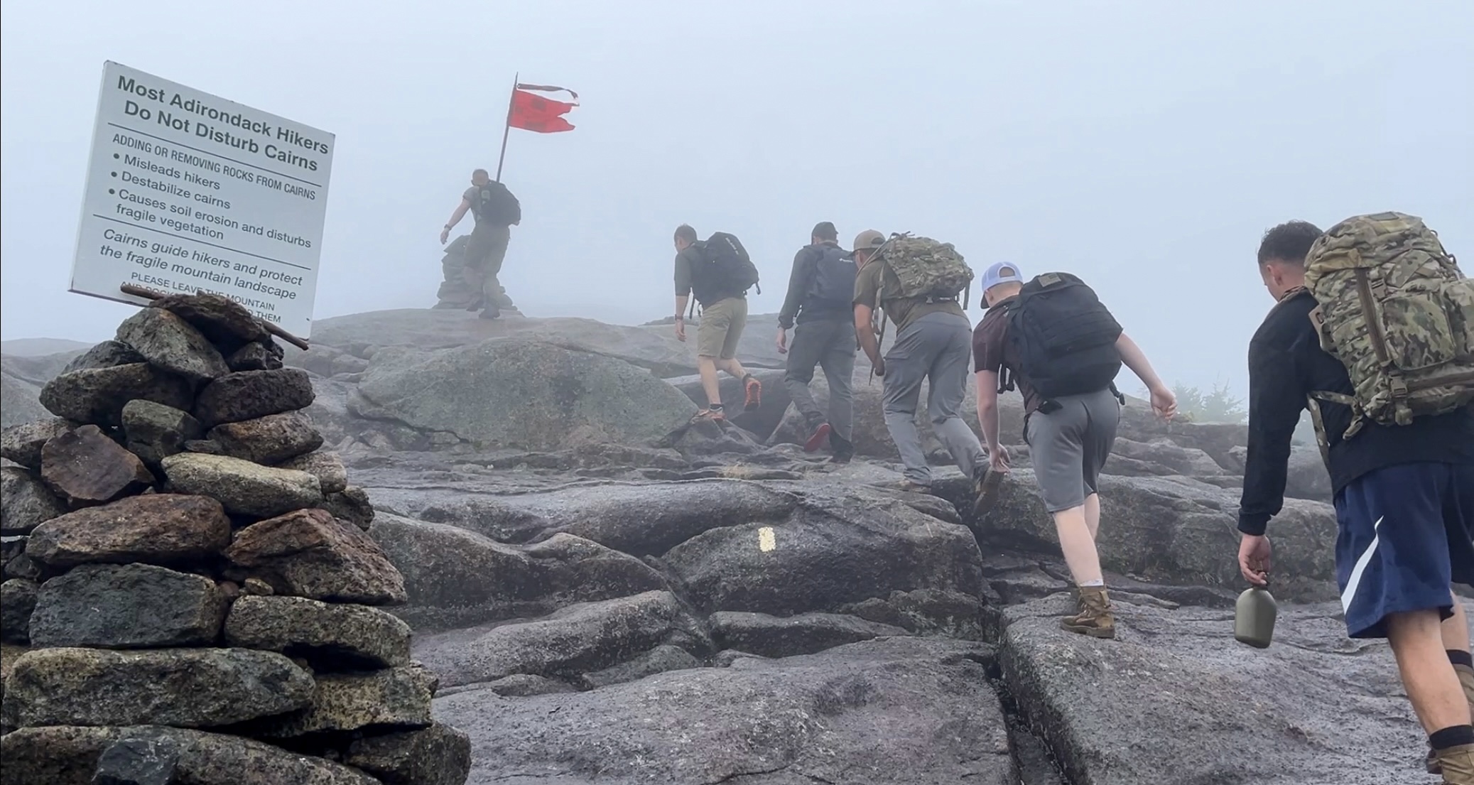 Soldiers reach the summit of Cascade Mountain.
