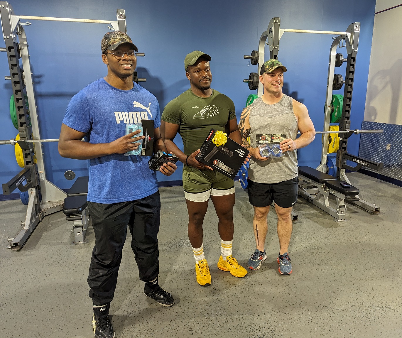 Three top competition finishers display their prizes.