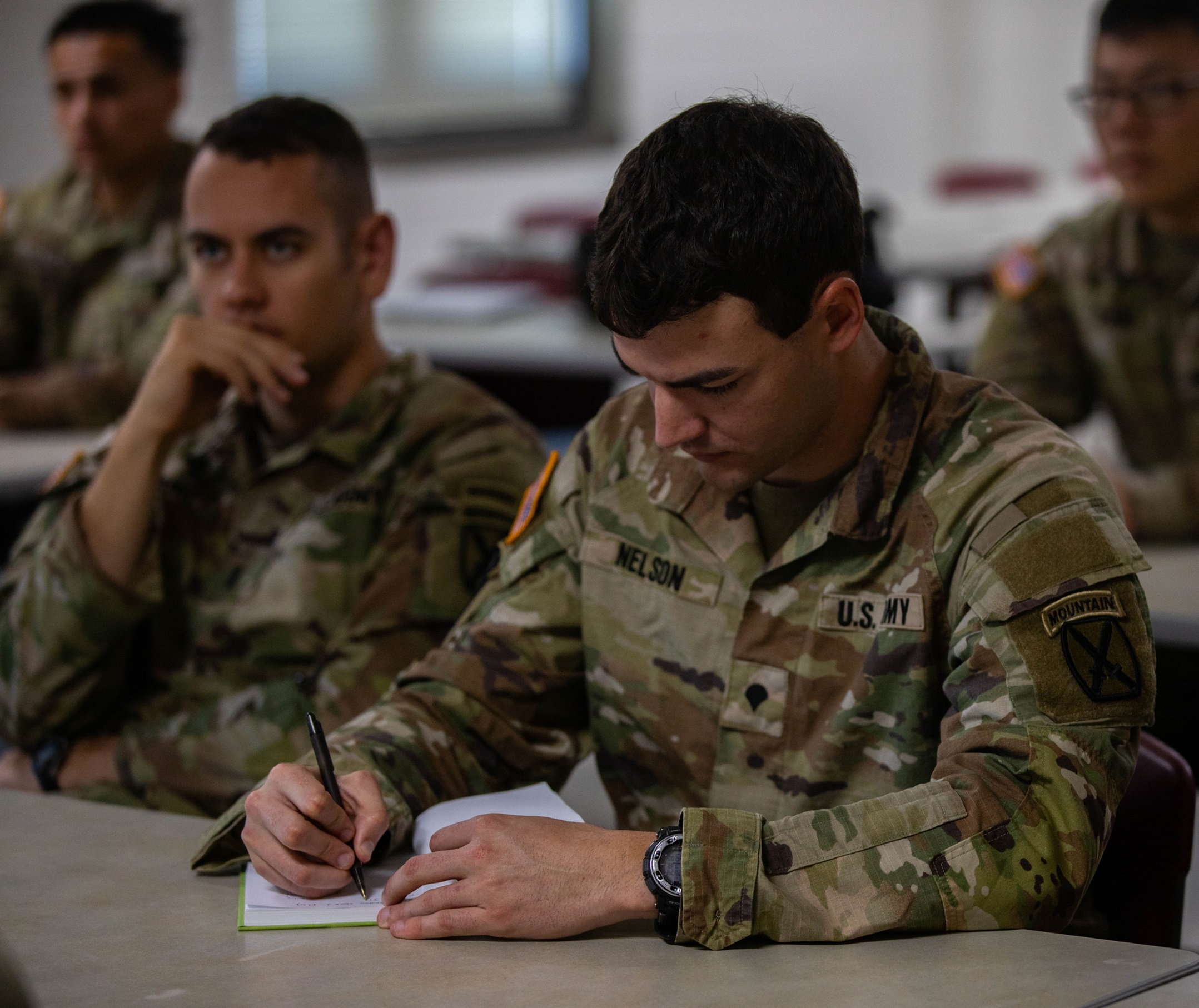 Soldier takes notes in a class during Desert Guardian on Fort Drum.
