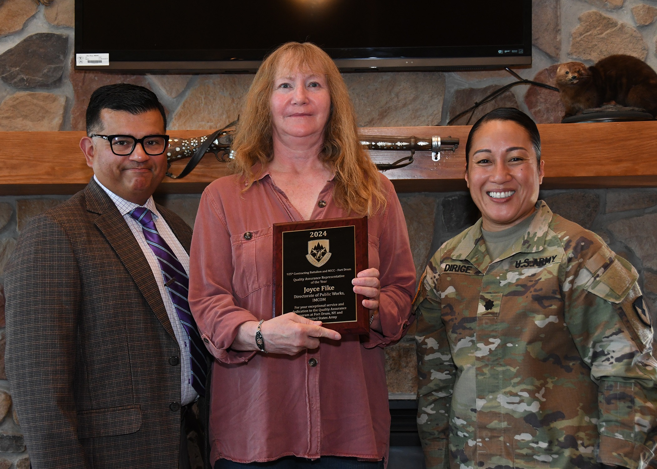 Joyce Fike accepts Quality Assurance Representative of the Year award.