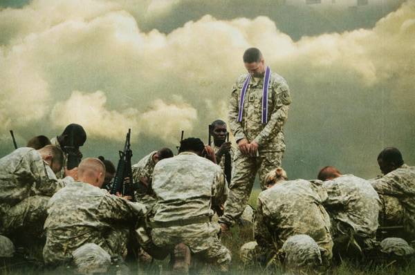 Chaplain-praying-in-the-field.jpg