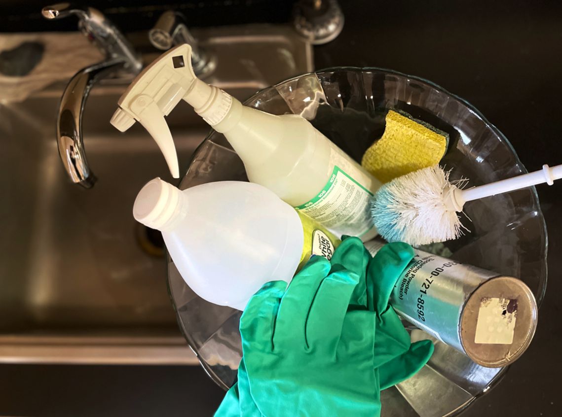 Photo of cleaning products on top of a sink