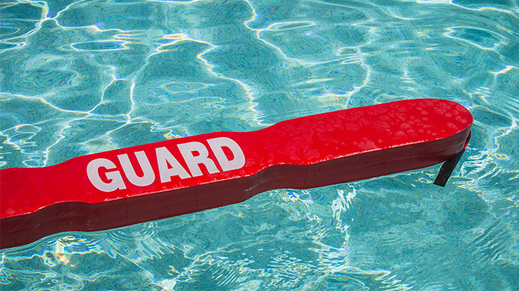 Stock image of a lifeguard floatation device in a pool