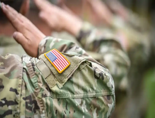Soldiers saluting the flag. 