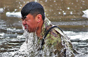 Photo: First Lt. James Wong, a civil-affairs officer with the Army Reserve’s 432nd Civil Affairs Battalion in Green Bay, Wis., and a Fort McCoy Cold-Weather Operations Course Class 21-01 student participates in cold-water immersion training Dec. 15, 2020, at Big Sandy Lake on South Post at Fort McCoy.